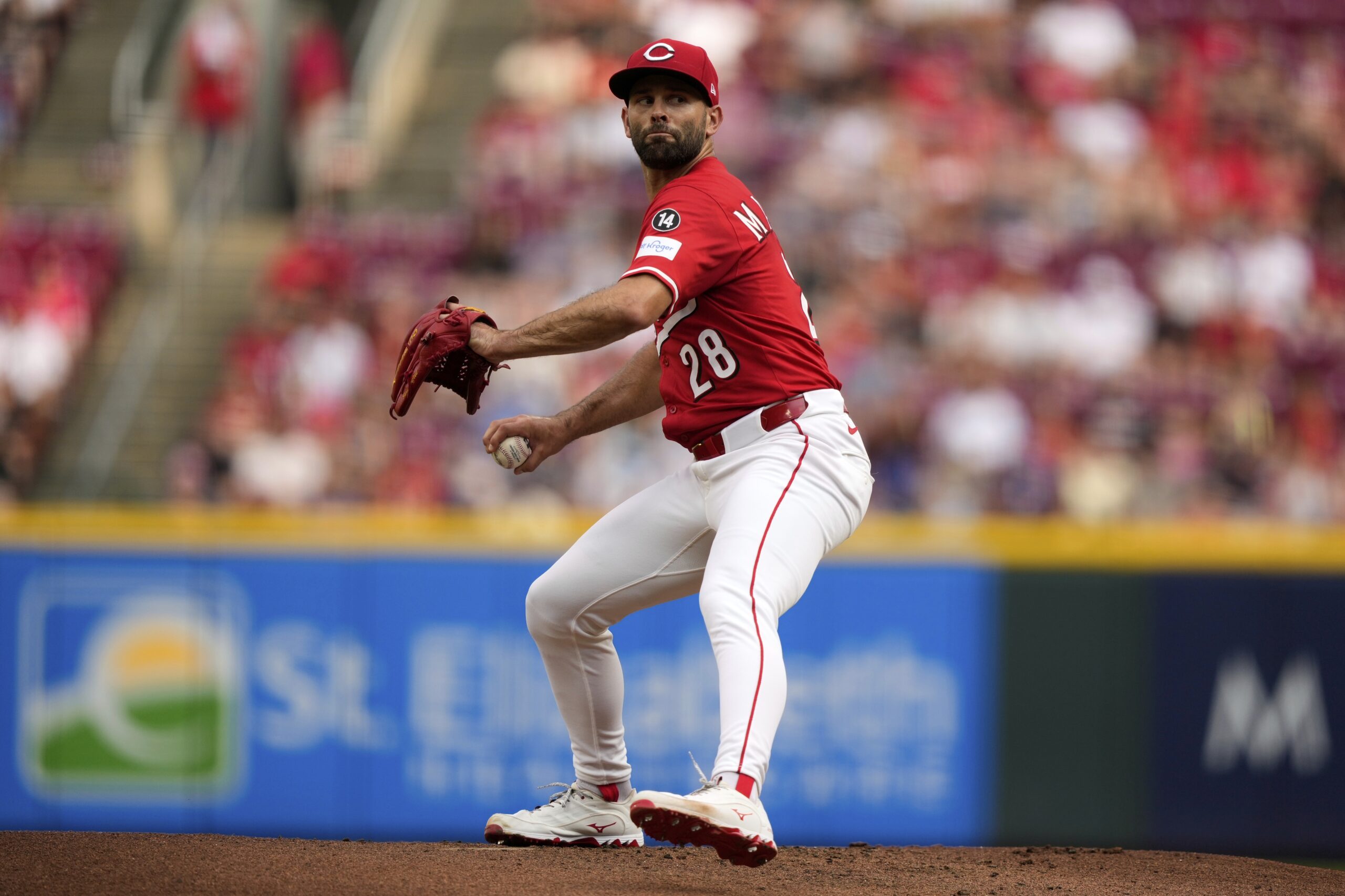 Cincinnati Reds starting pitcher Nick Martinez throws to the plate...