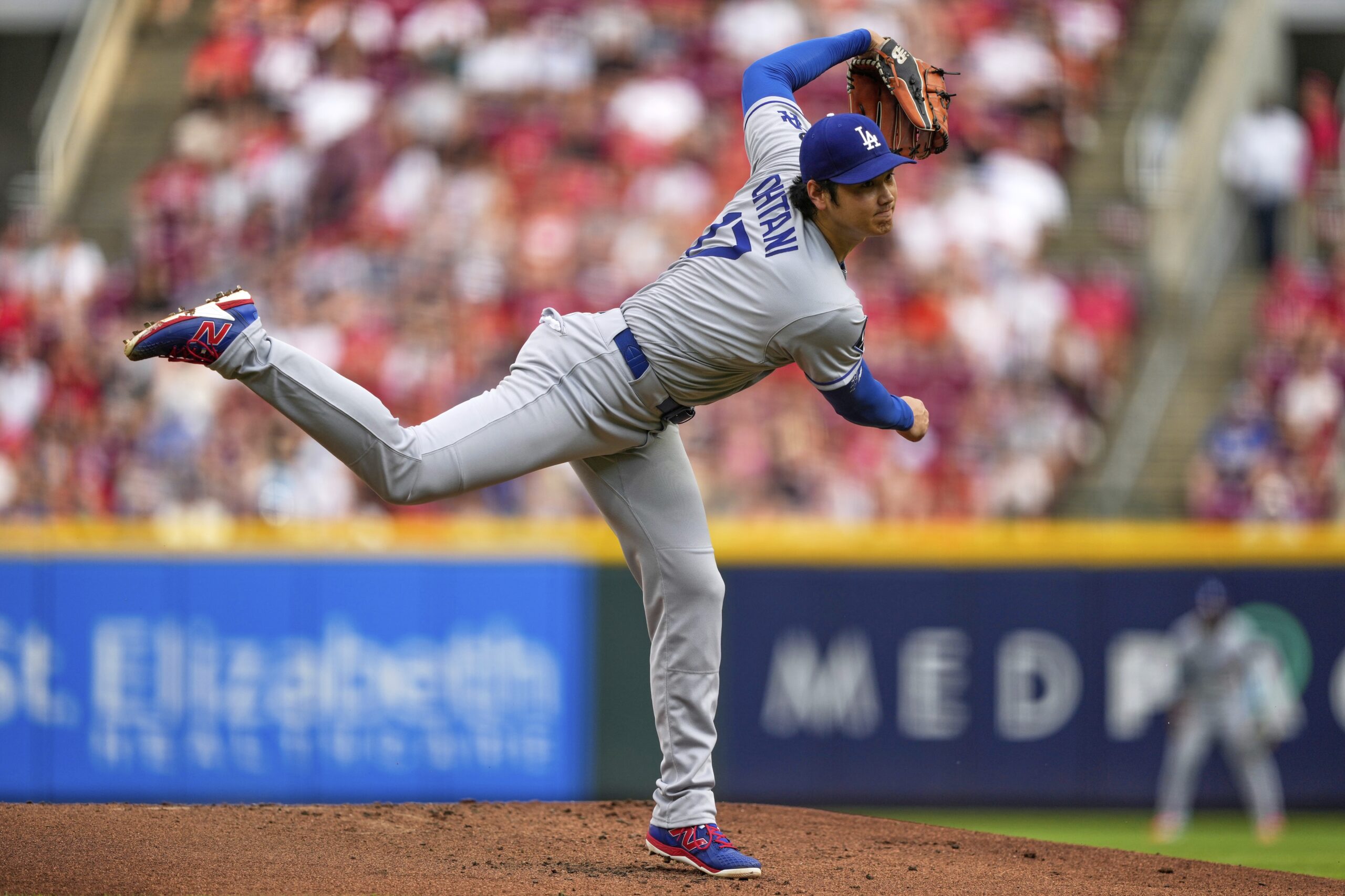 Dodgers starting pitcher Shohei Ohtani throws to the plate during...