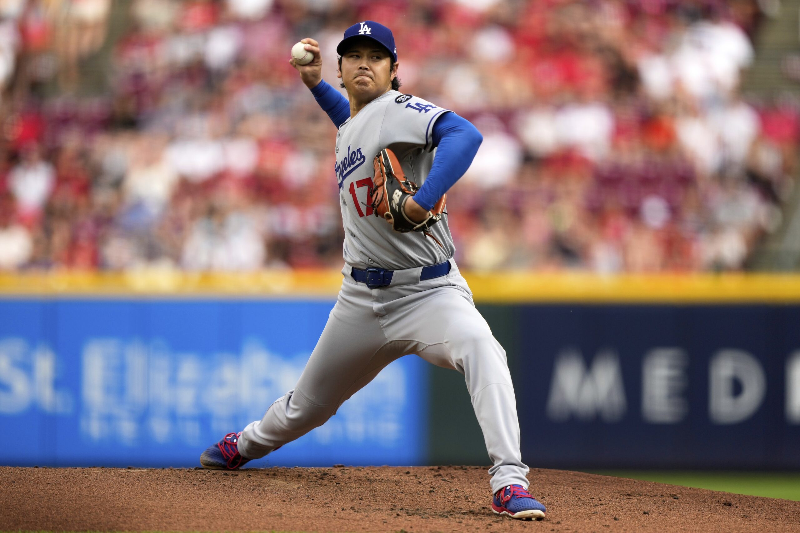 Dodgers starting pitcher Shohei Ohtani throws to the plate during...