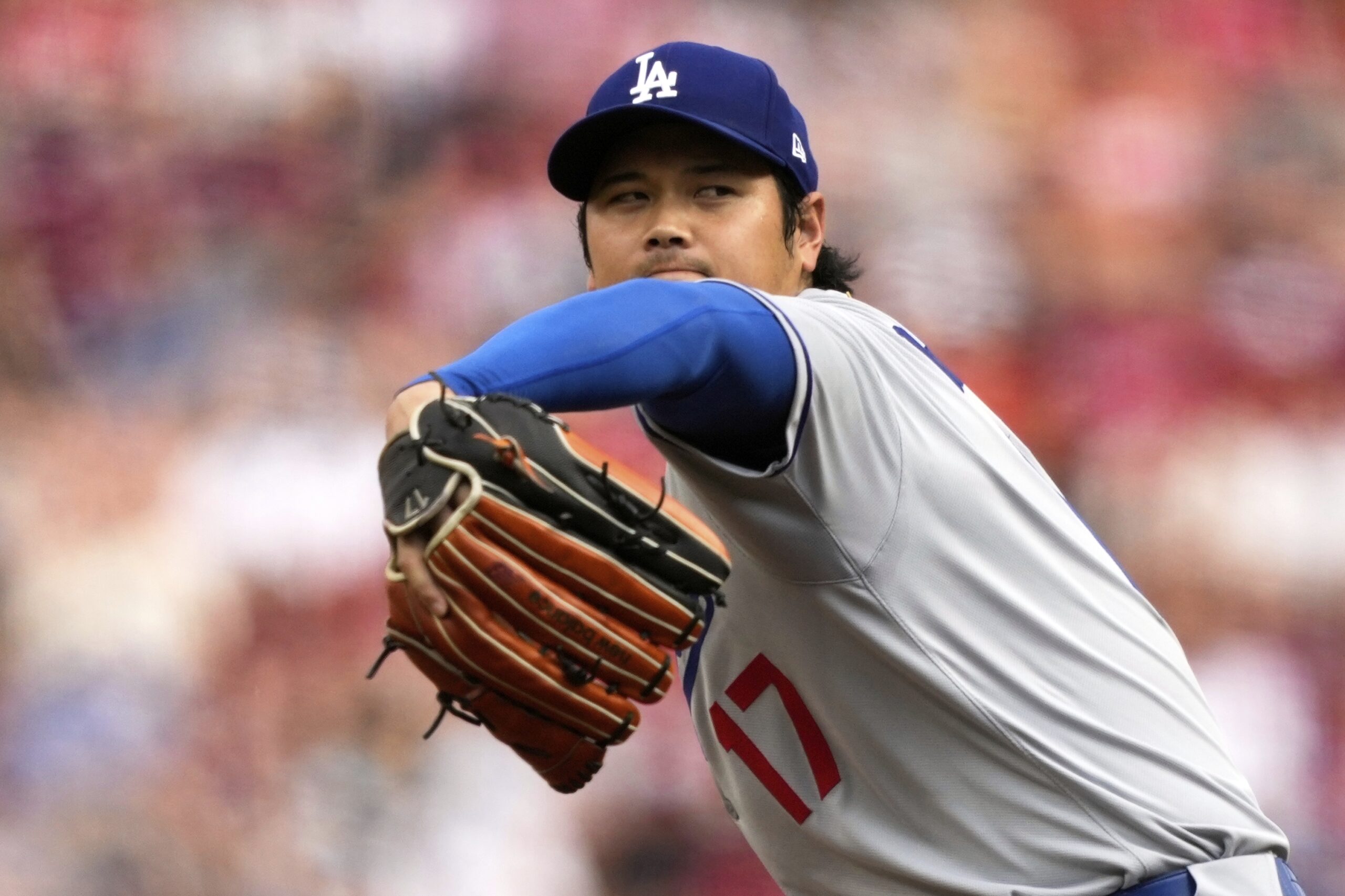Dodgers starting pitcher Shohei Ohtani throws to the plate during...