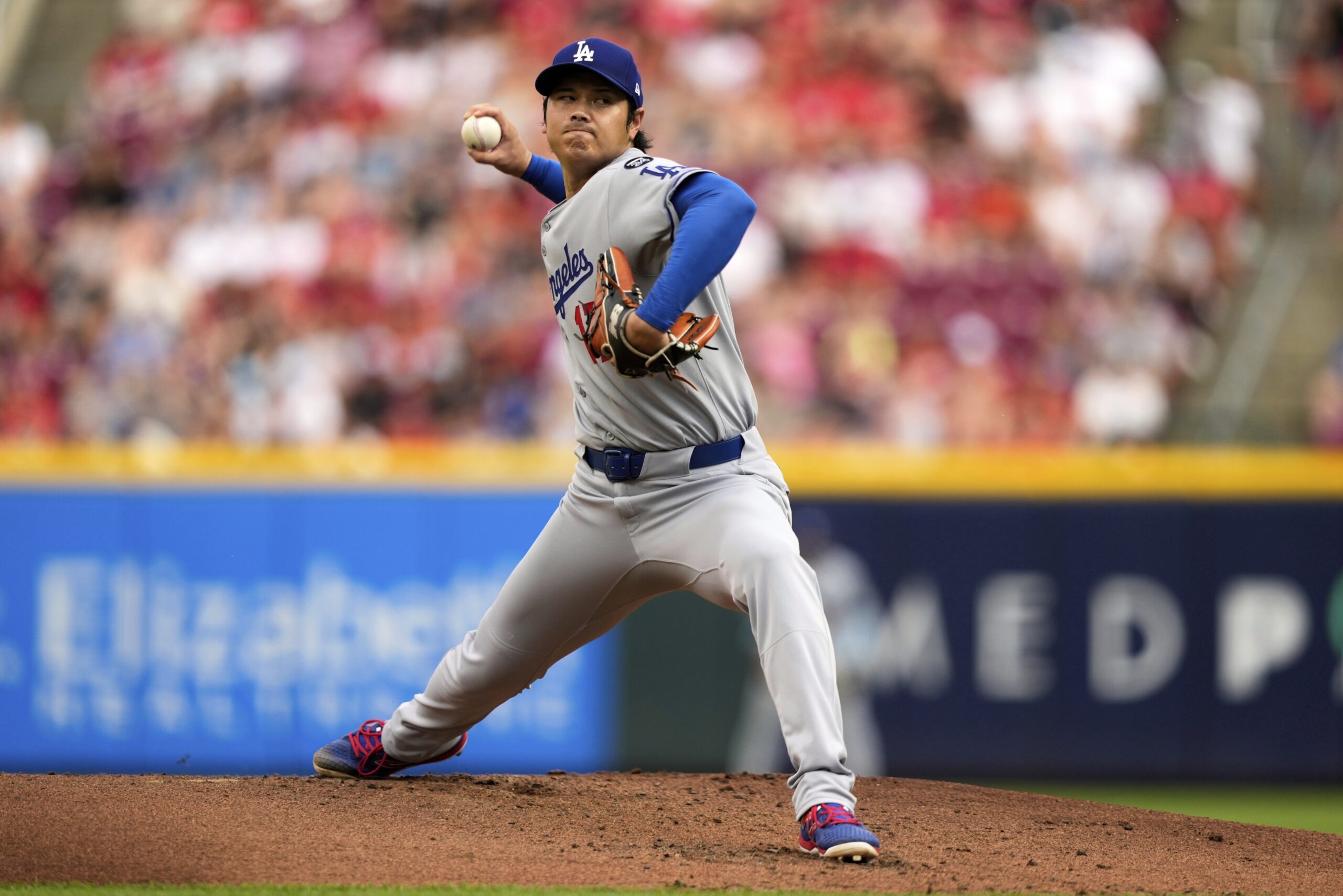 Dodgers starting pitcher Shohei Ohtani throws to the plate during...