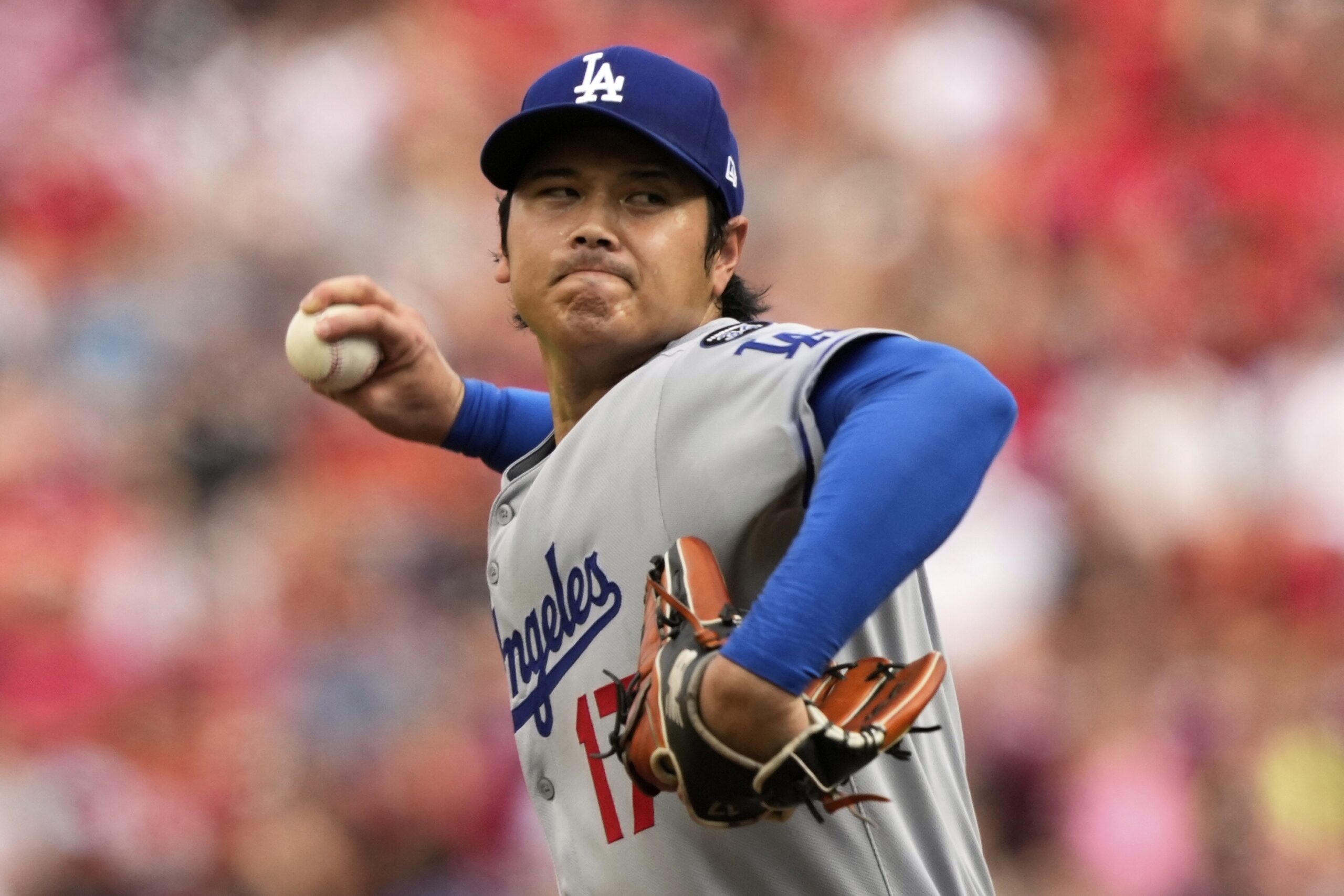 Dodgers starting pitcher Shohei Ohtani throws to the plate during...