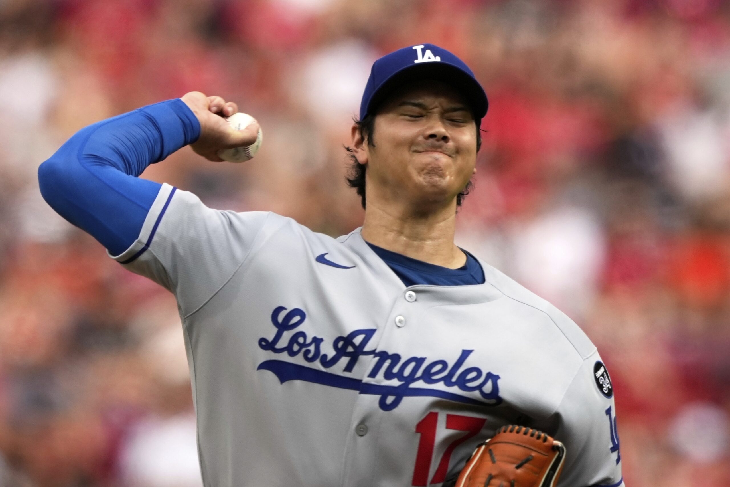 Dodgers starting pitcher Shohei Ohtani throws to the plate during...