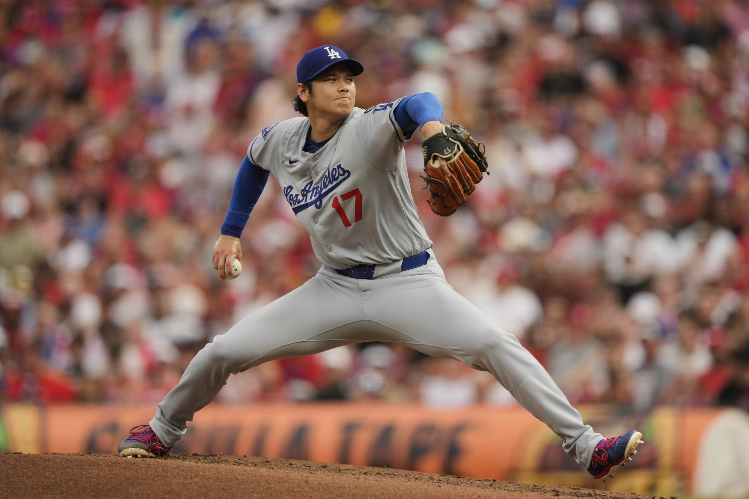 Dodgers starting pitcher Shohei Ohtani throws to the plate during...