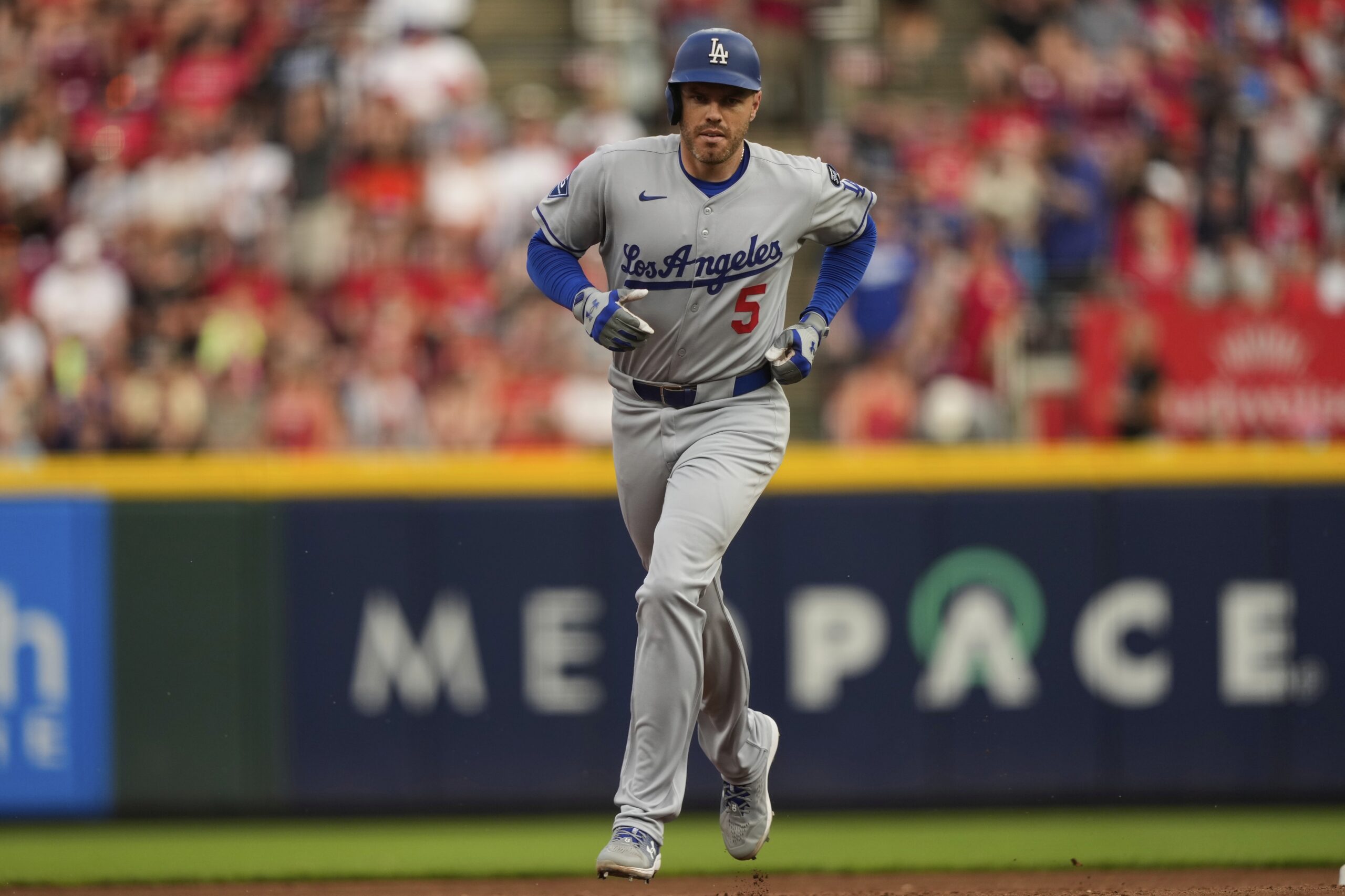 The Dodgers’ Freddie Freeman runs the bases after hitting a...