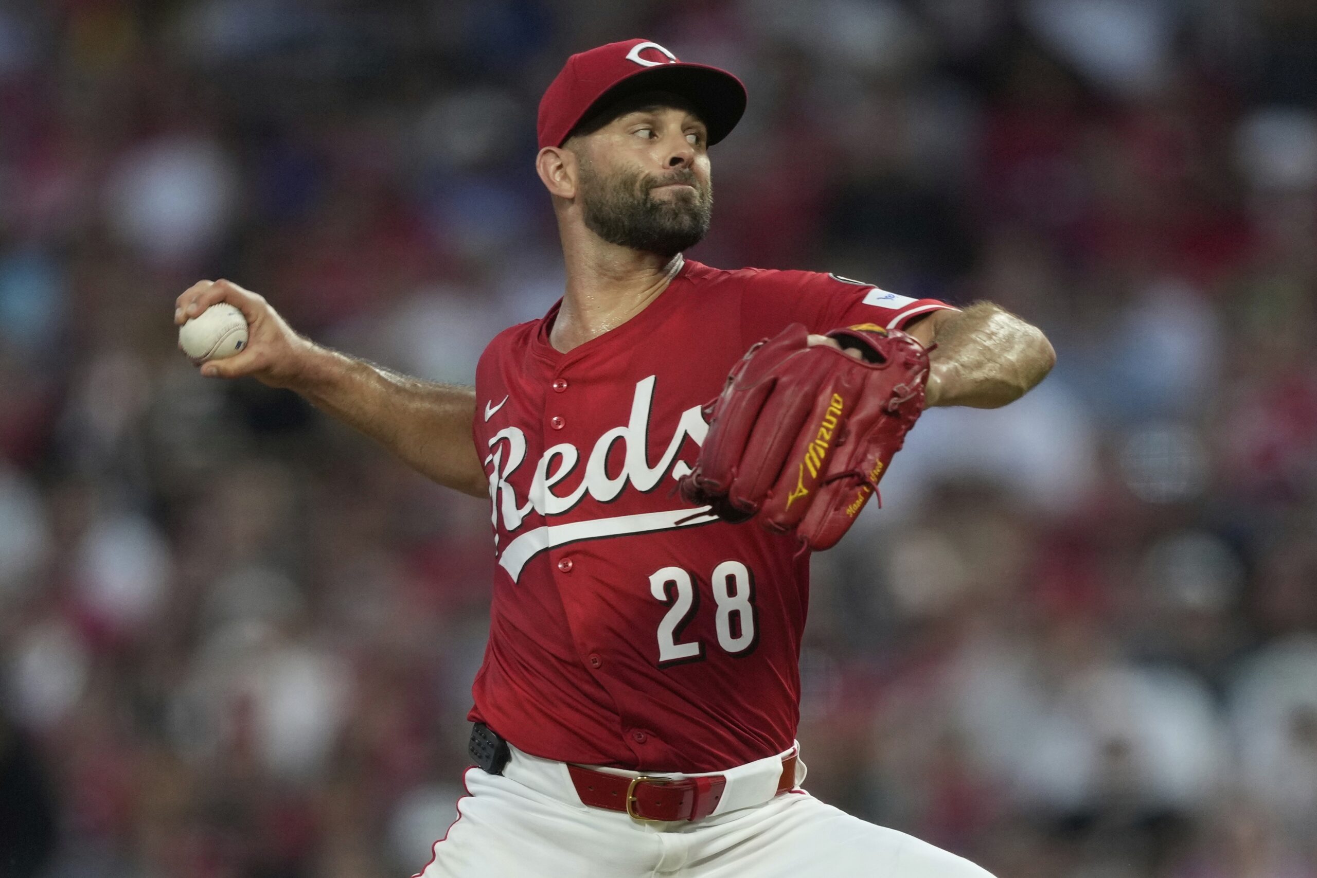Cincinnati Reds relief pitcher Nick Martinez throws to the plate...