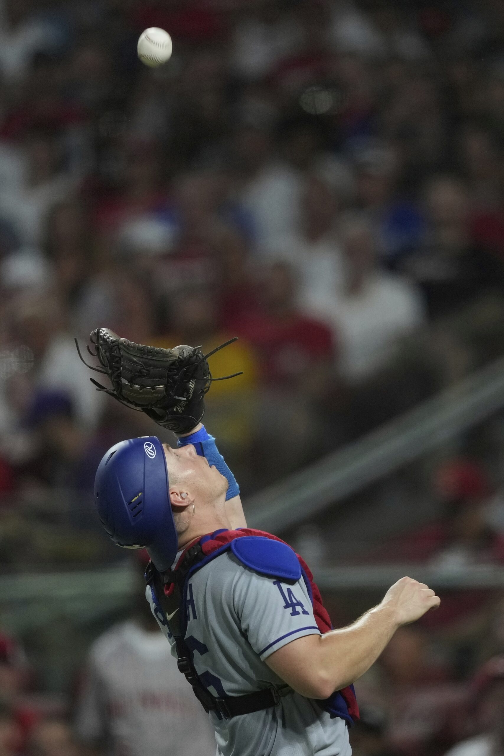 Dodgers catcher Will Smith catches a pop fly during the...