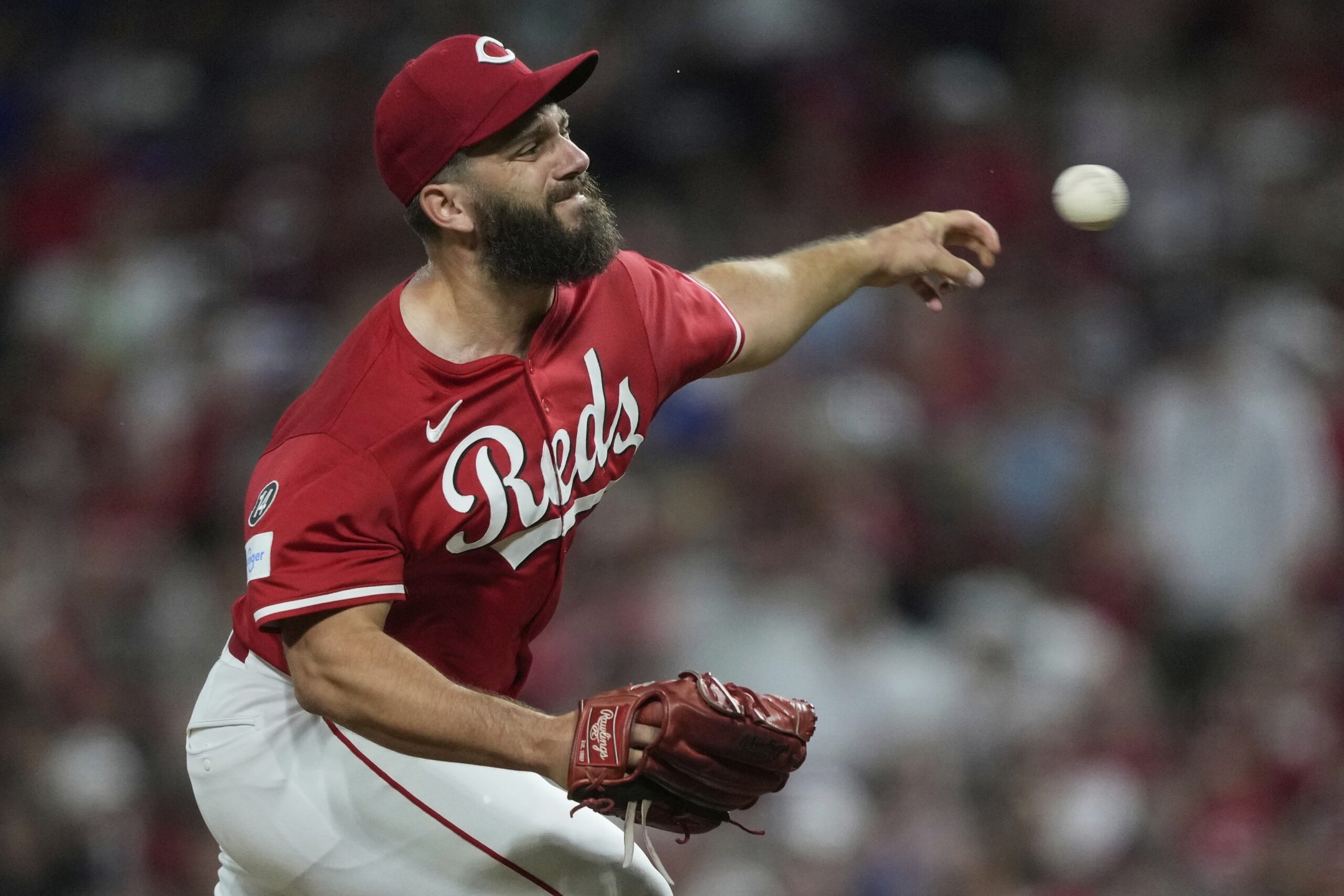 Cincinnati Reds relief pitcher Taylor Rogers throws to the plate...