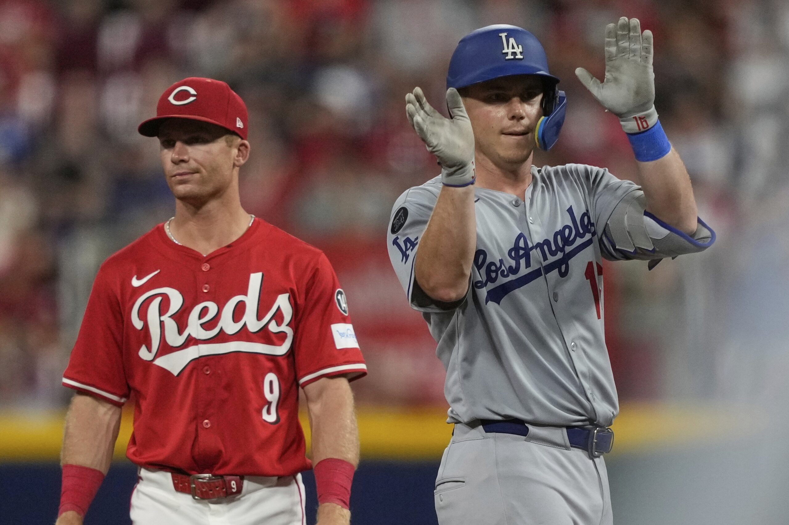 The Dodgers’ Will Smith reacts in front of the Cincinnati...