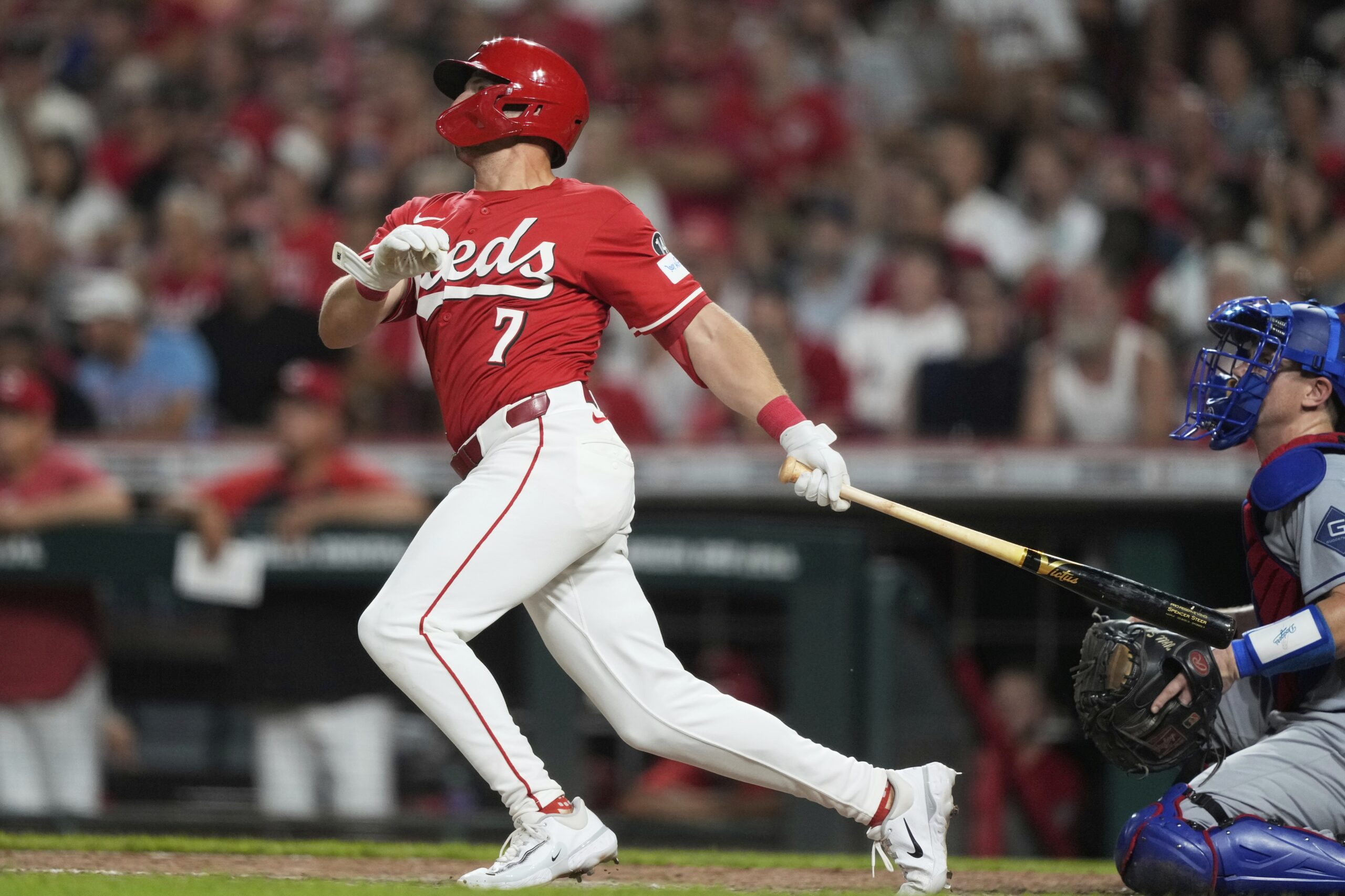The Cincinnati Reds’ Spencer Steer hits a two-run triple during...