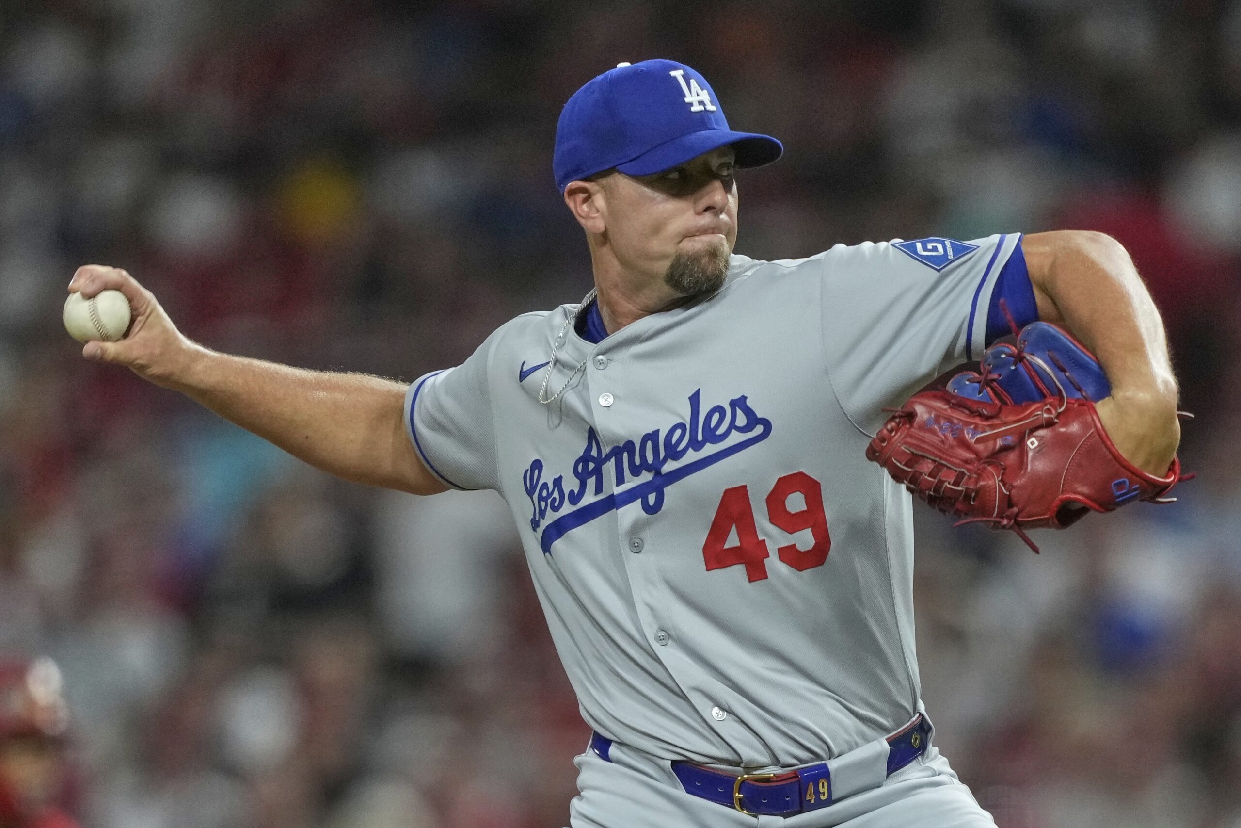 Dodgers relief pitcher Blake Treinen throws to the plate during...