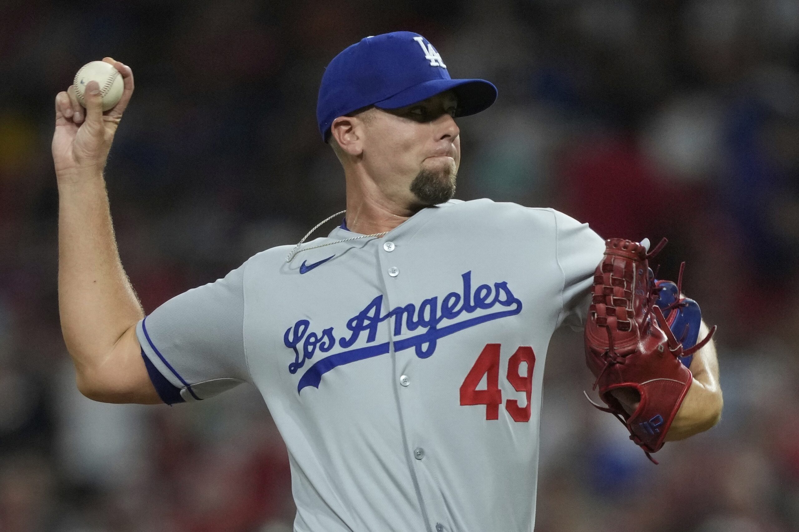Dodgers relief pitcher Blake Treinen throws to the plate during...