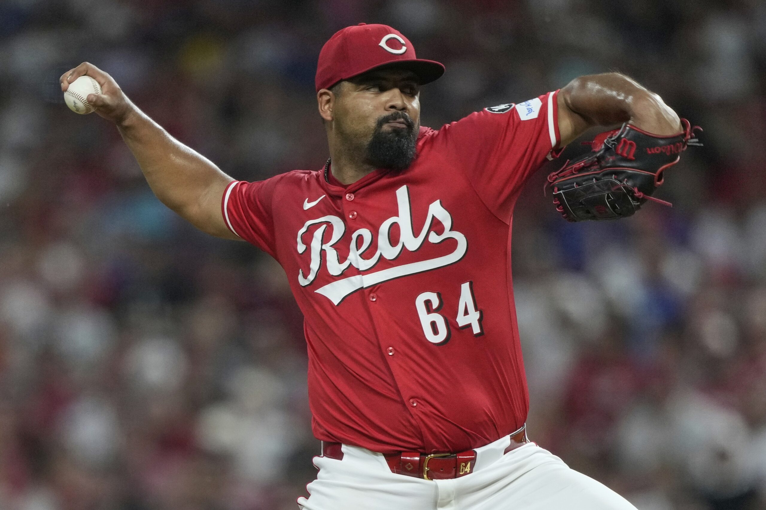 Cincinnati Reds relief pitcher Tony Santillan throws to the plate...