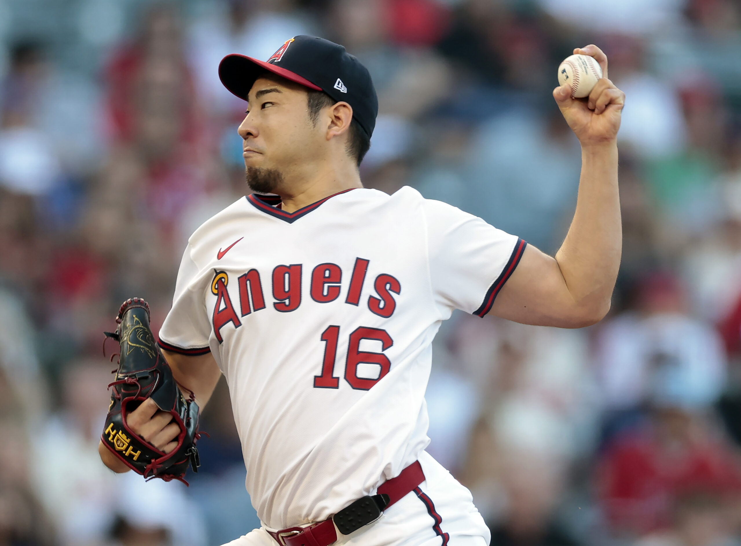 Angels starting pitcher Yusei Kikuchi throws to the plate during...