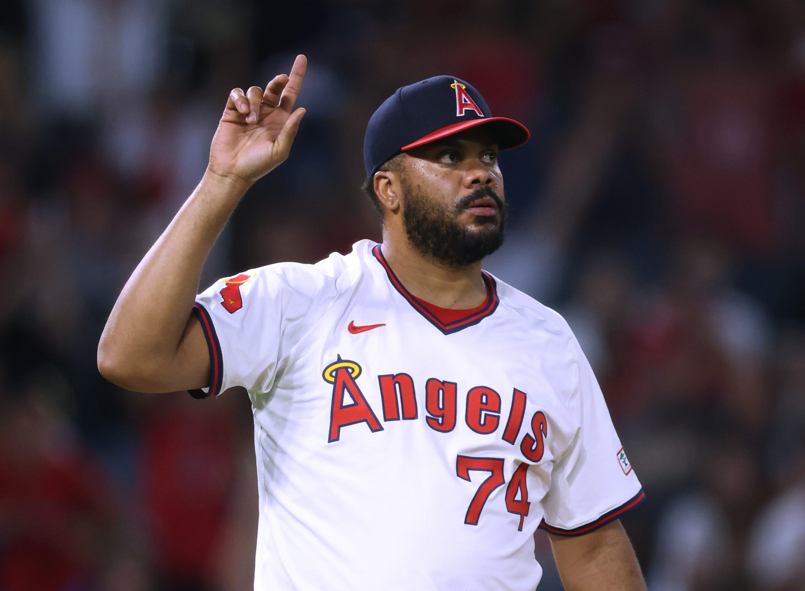 Angels relief pitcher Kenley Jansen gestures after the final out...