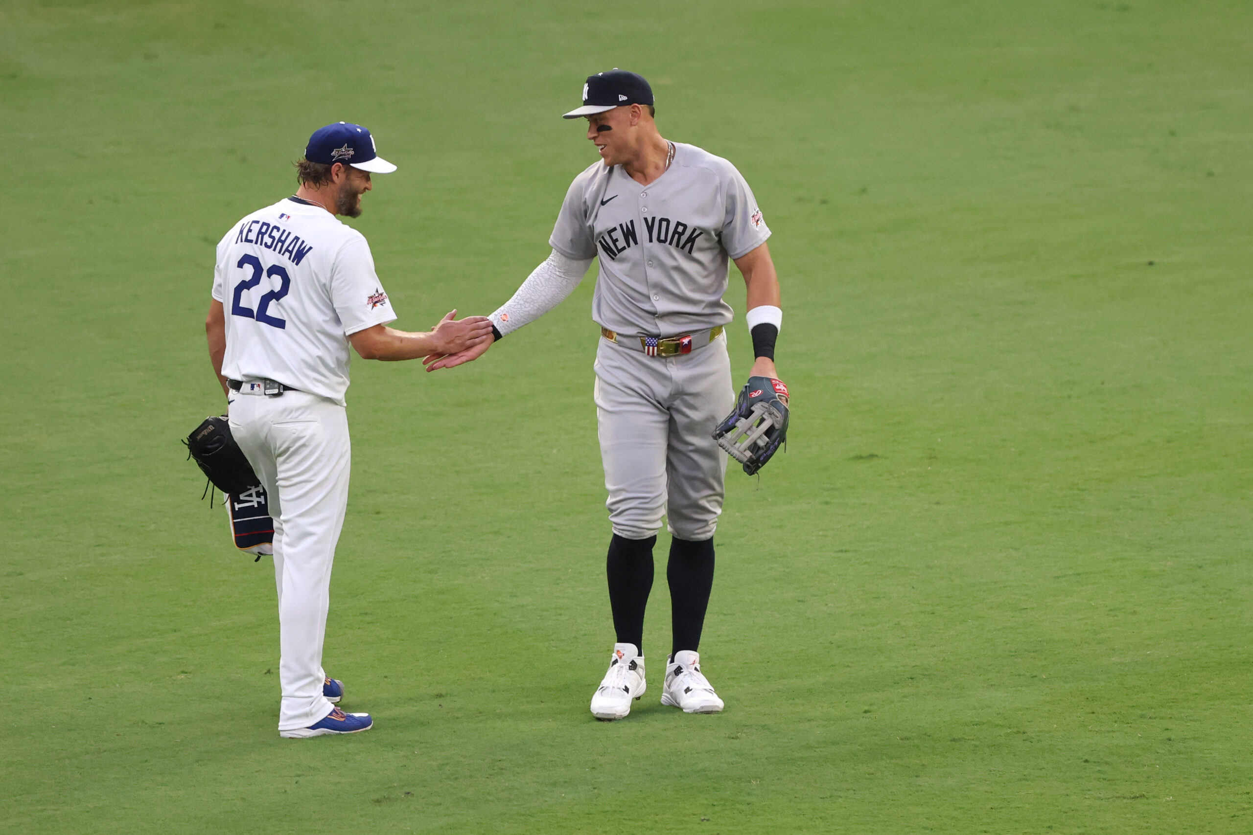 Dodgers pitcher Clayton Kershaw, left, and New York Yankees outfielder...