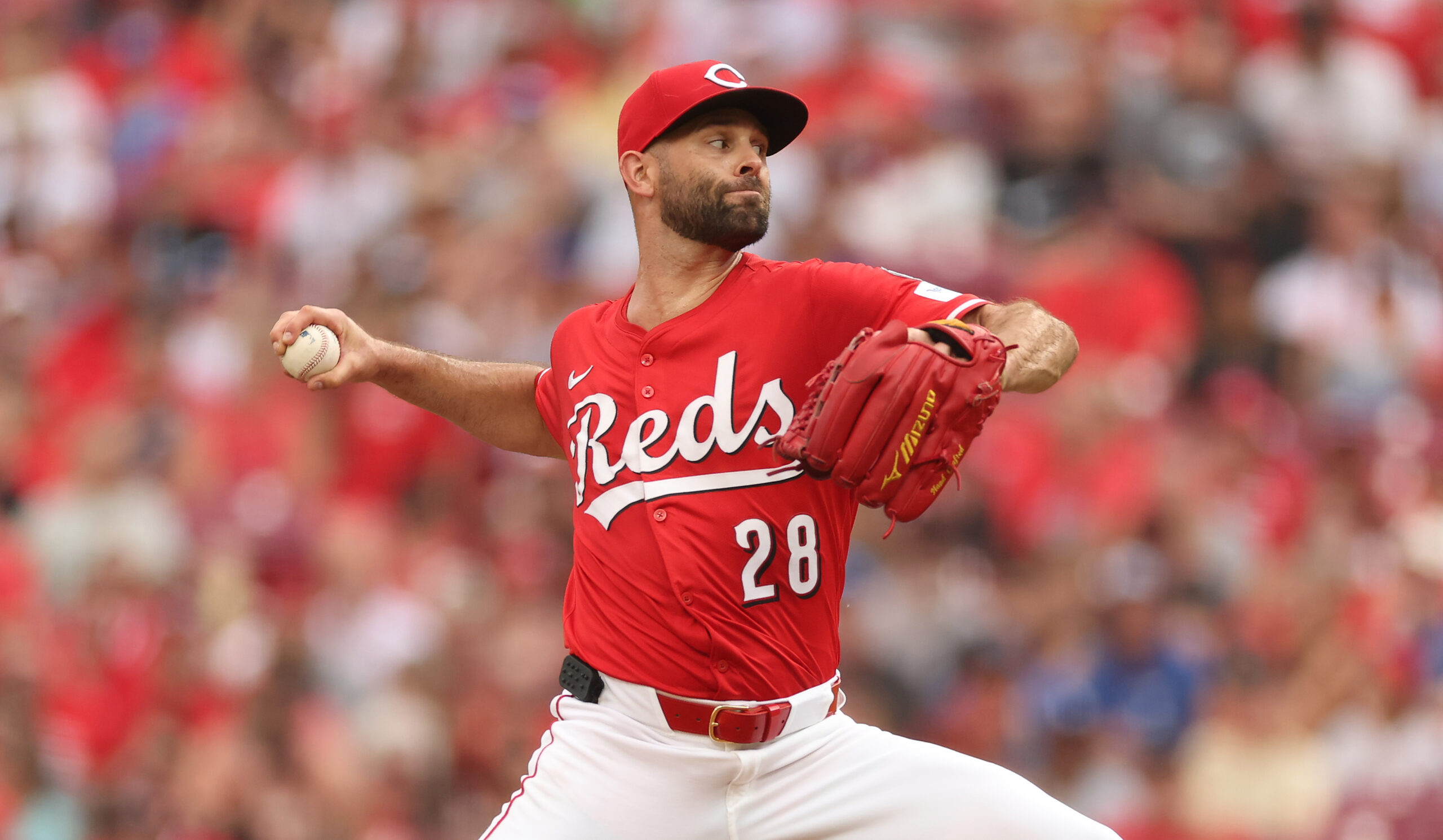 Cincinnati Reds starting pitcher Nick Martinez throws to the plate...