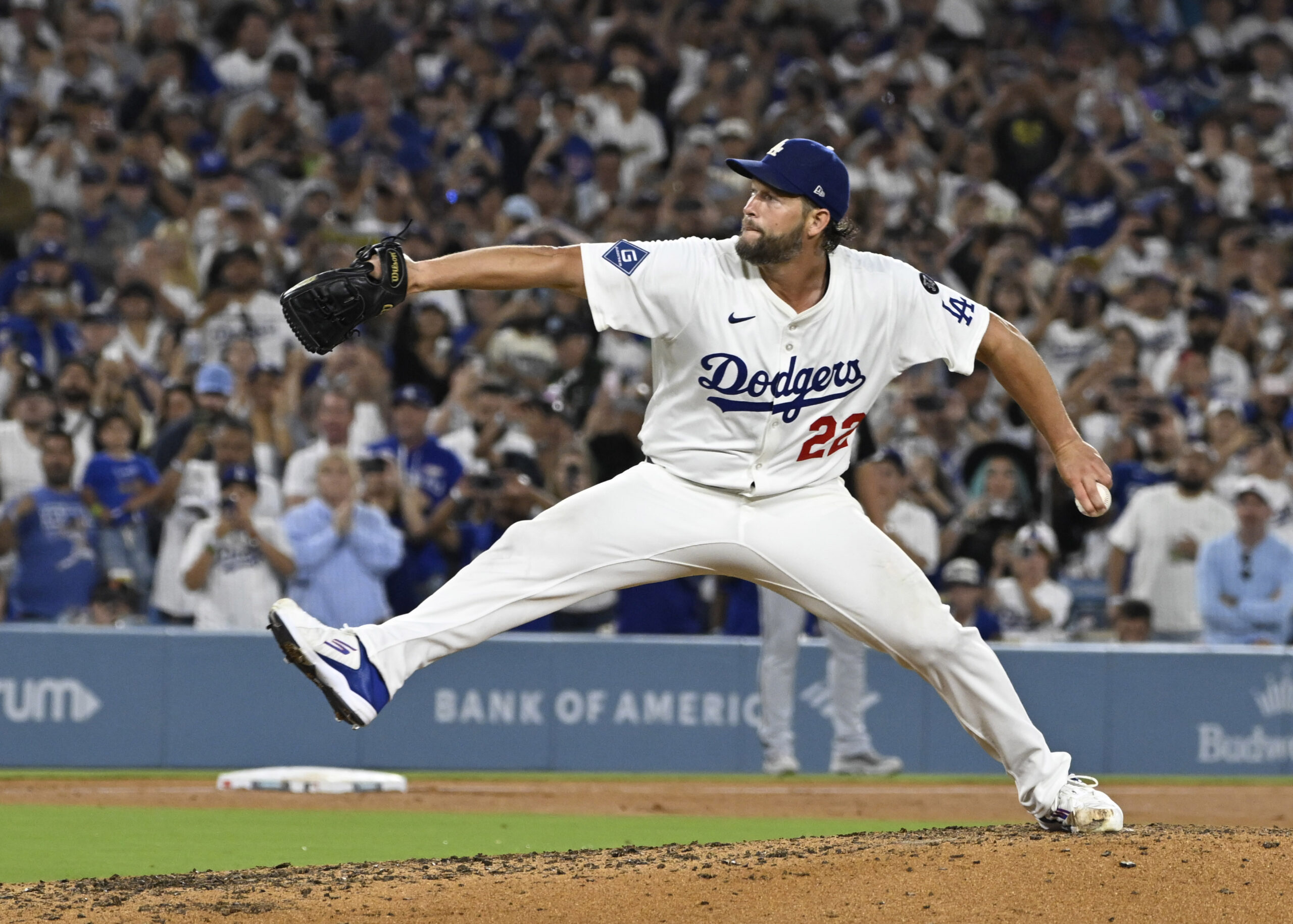 Clayton Kershaw #22 of the Los Angeles Dodgers strikes out...