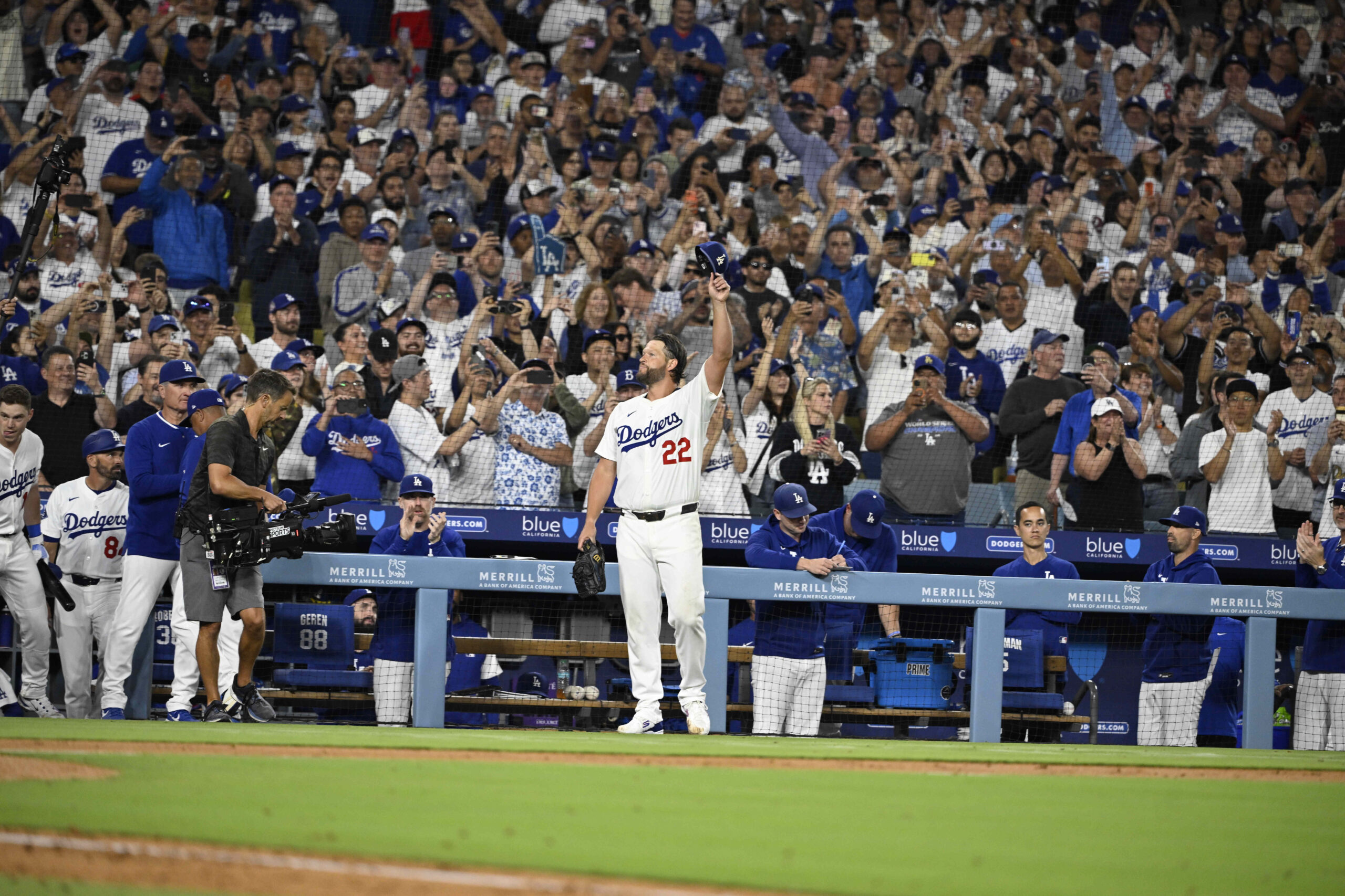 Clayton Kershaw #22 of the Los Angeles Dodgers tips his...