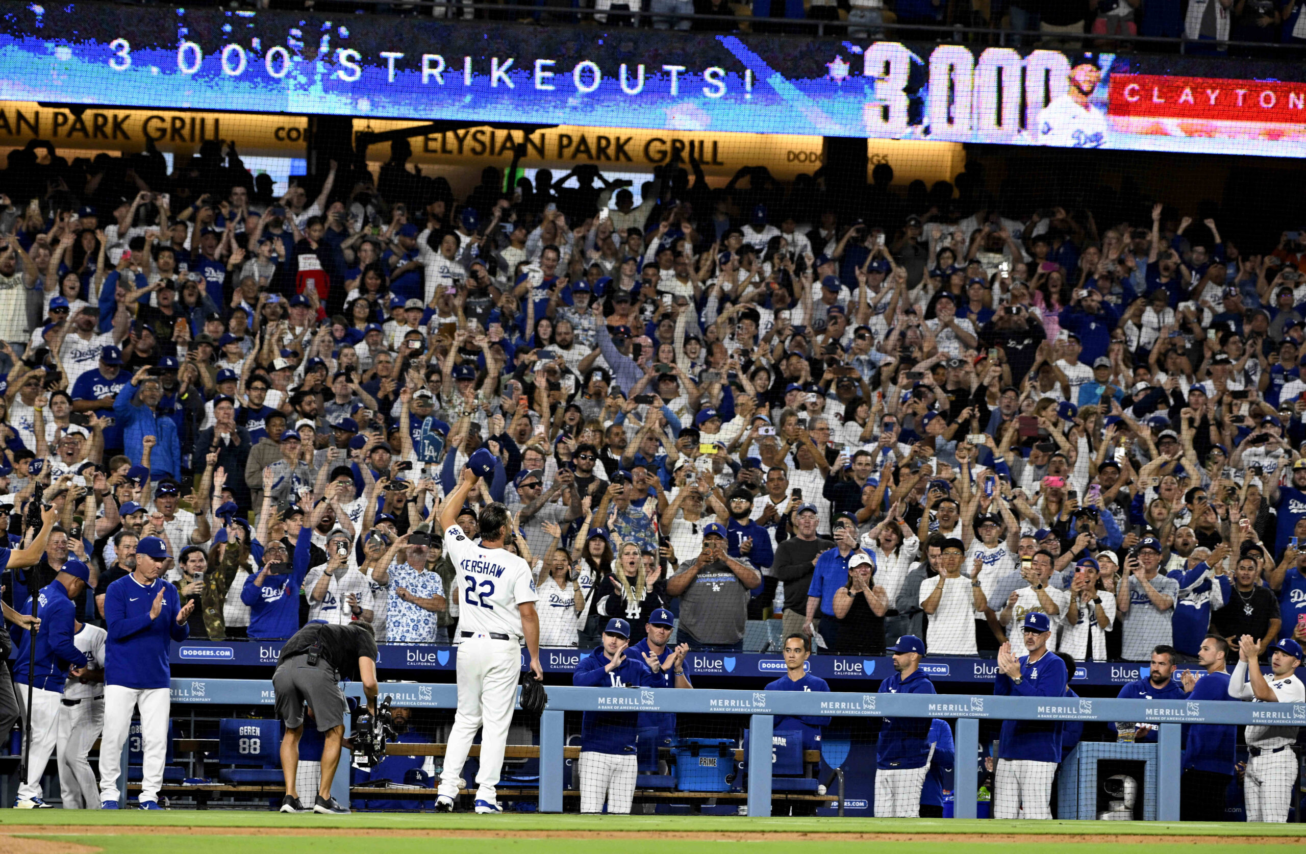 Clayton Kershaw #22 of the Los Angeles Dodgers tips his...