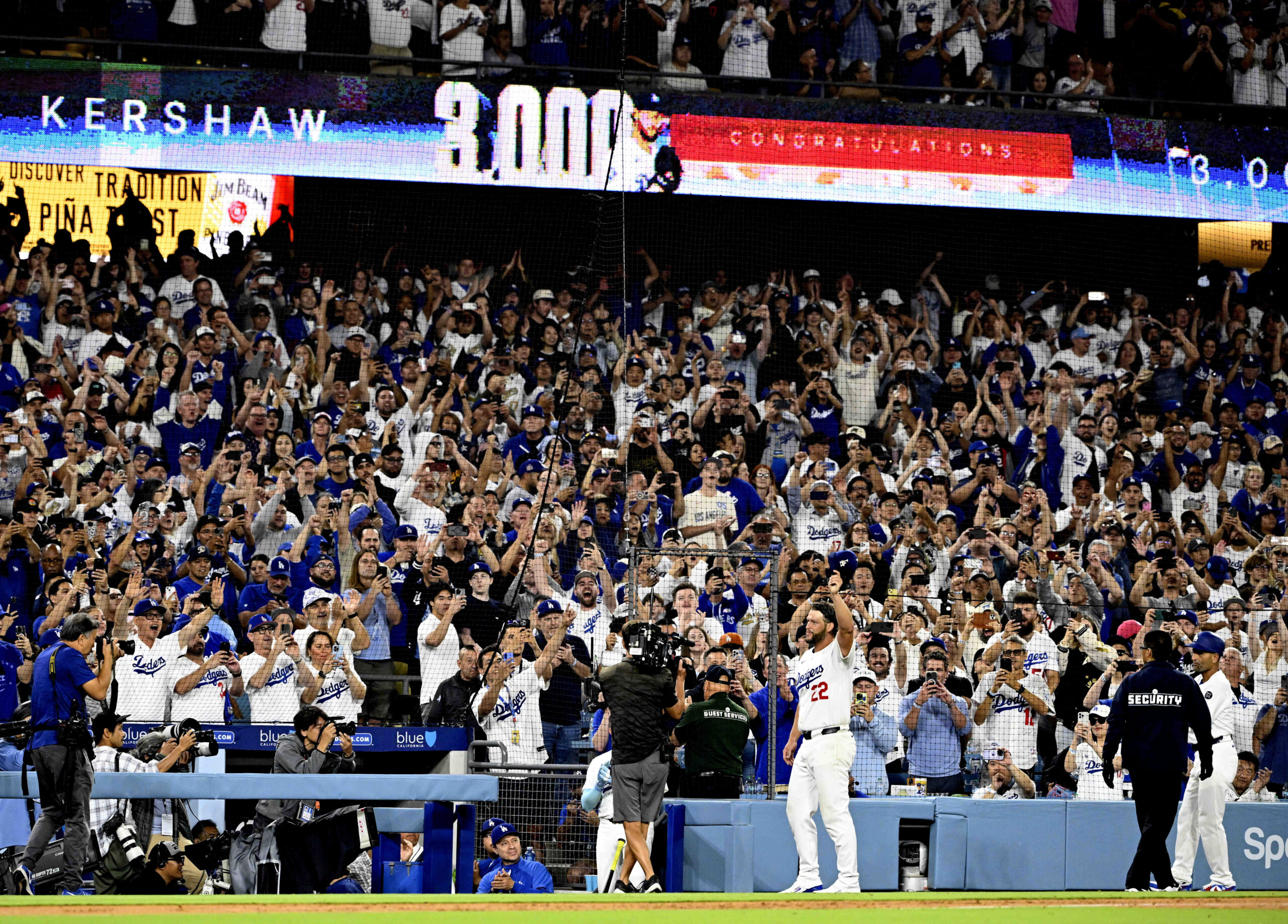 Dodgers starting pitcher Clayton Kershaw tips his cap to the...
