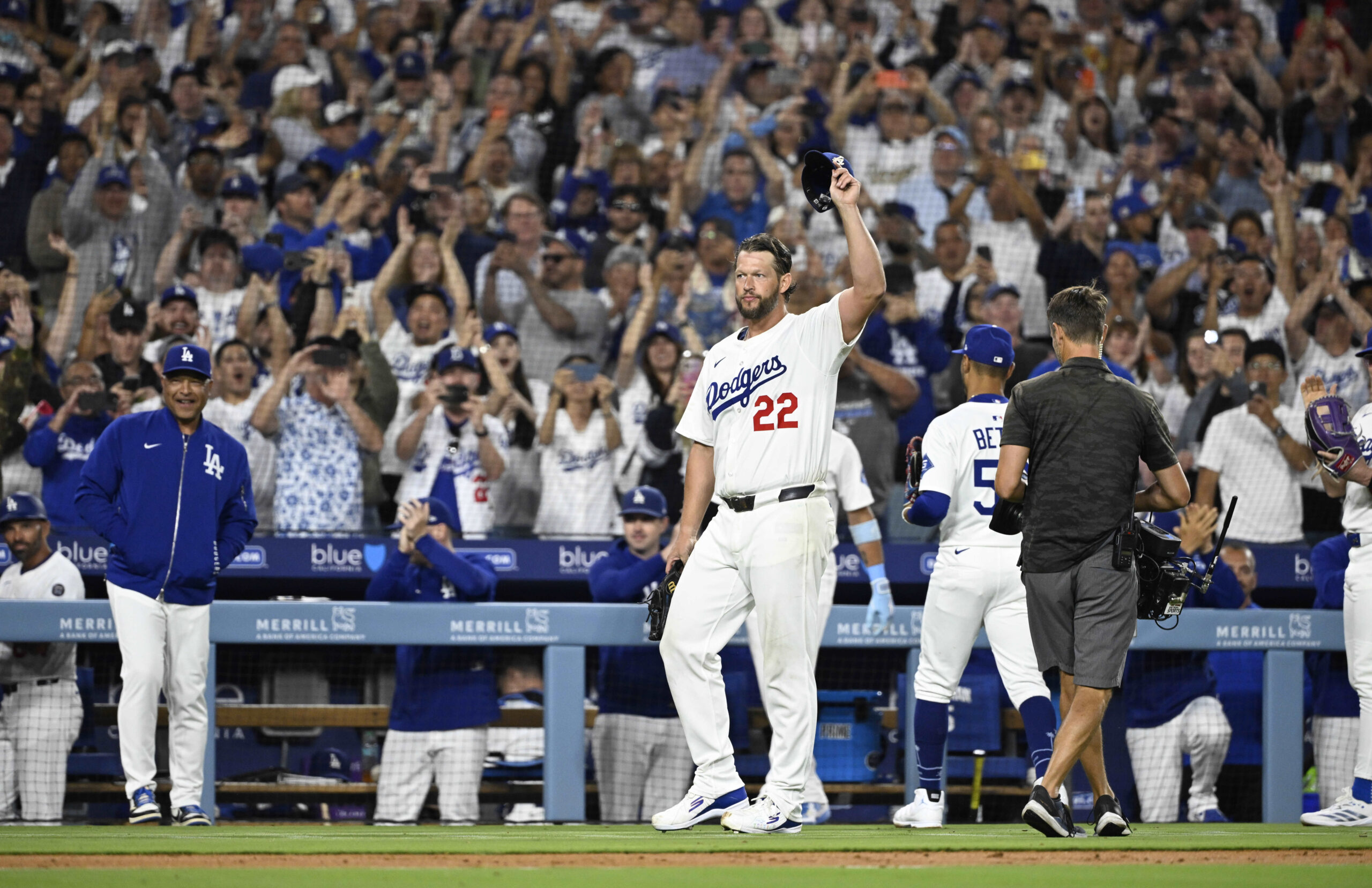Dodgers starting pitcher Clayton Kershaw tips his cap to the...