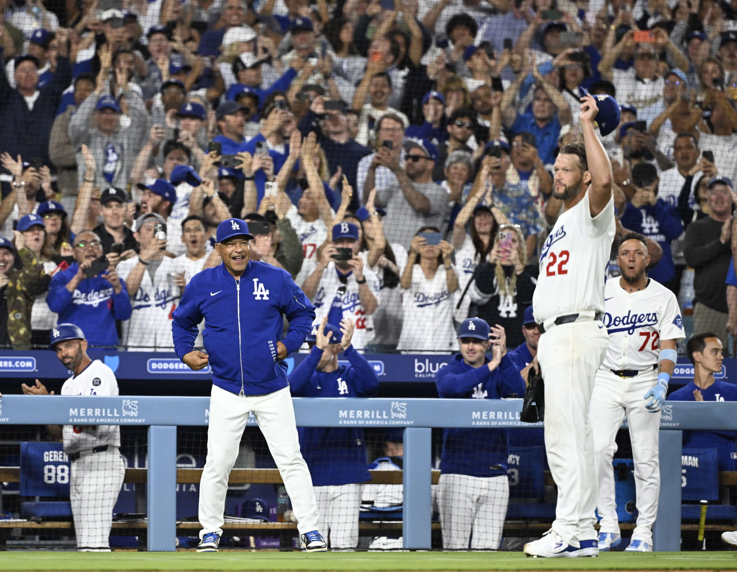 Dodgers starting pitcher Clayton Kershaw tips his cap to the...