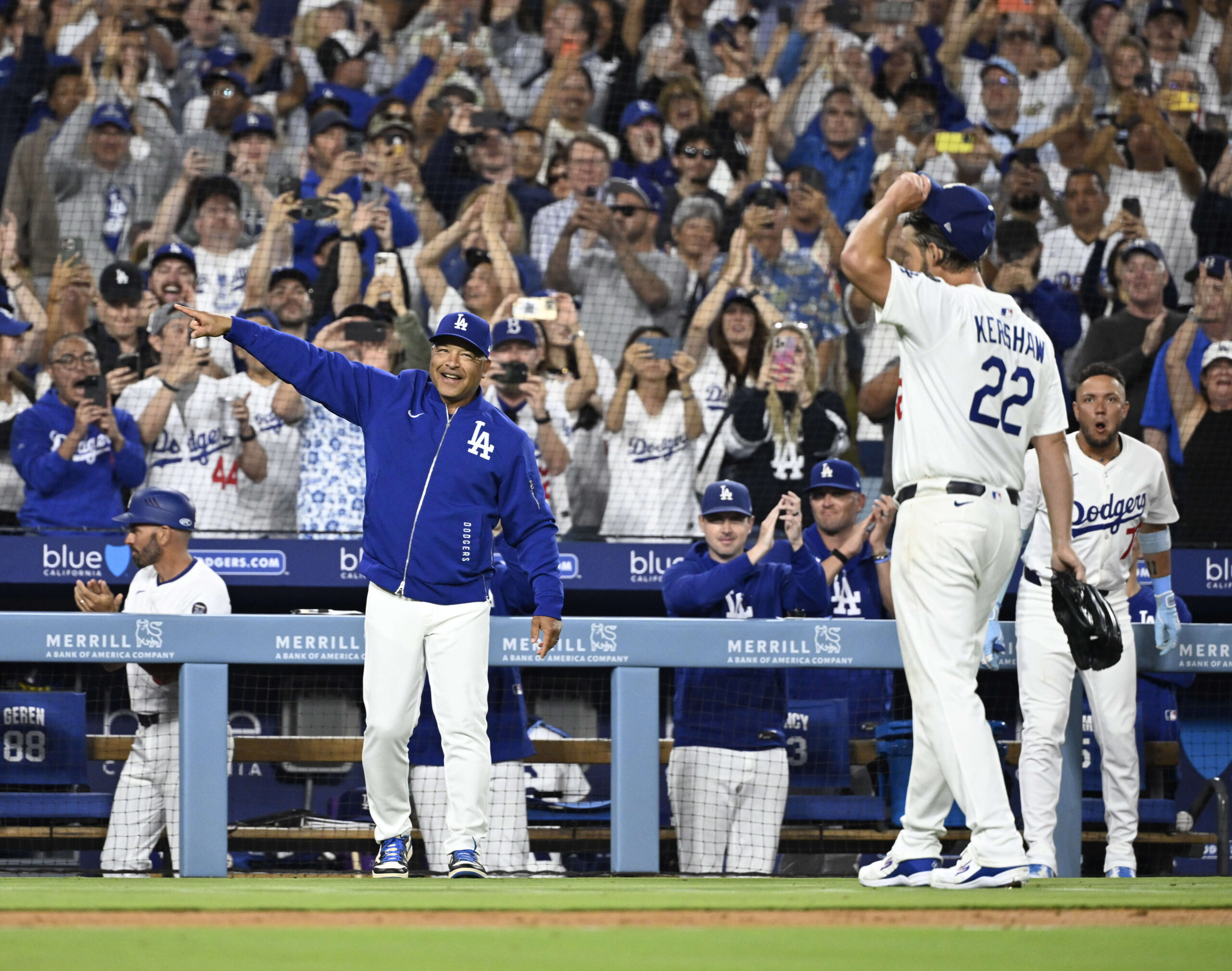 Dodgers starting pitcher Clayton Kershaw (22) looks toward his family...