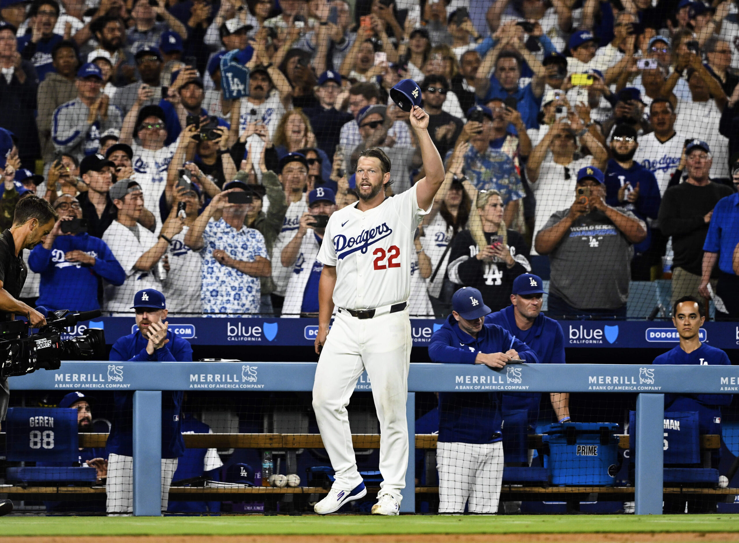 Dodgers starting pitcher Clayton Kershaw tips his cap to the...