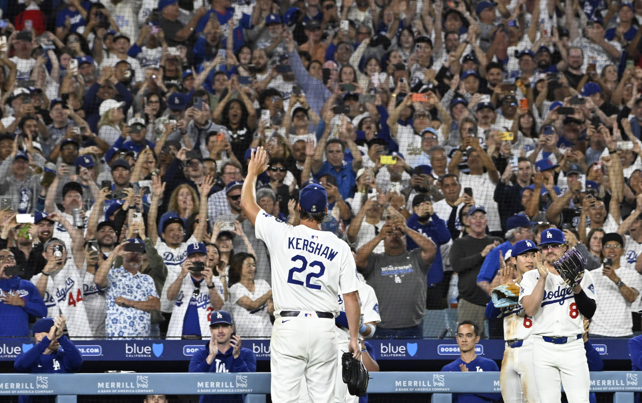 Dodgers starting pitcher Clayton Kershaw waves to the crowd after...