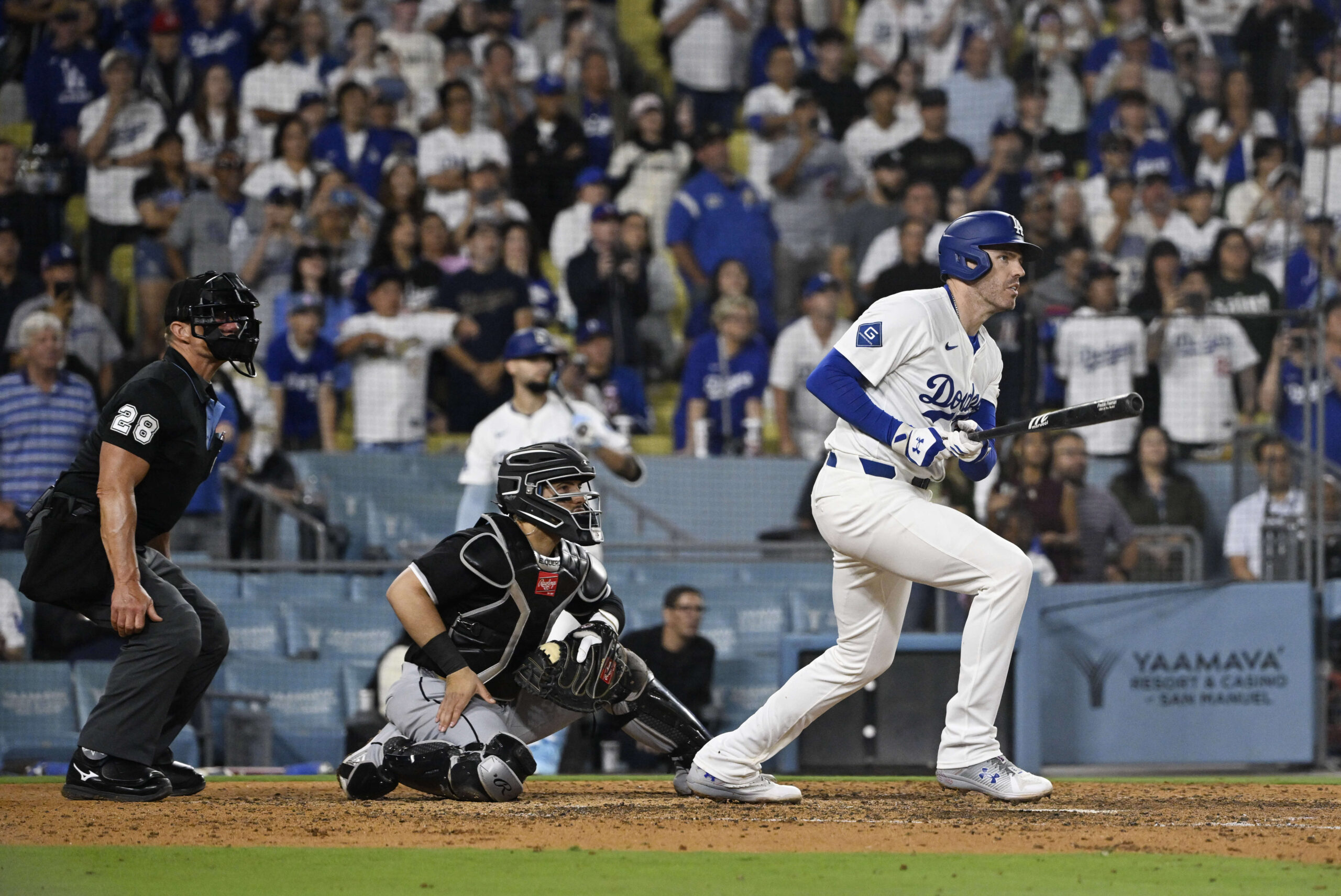Freddie Freeman #5 of the Los Angeles Dodgers watches his...