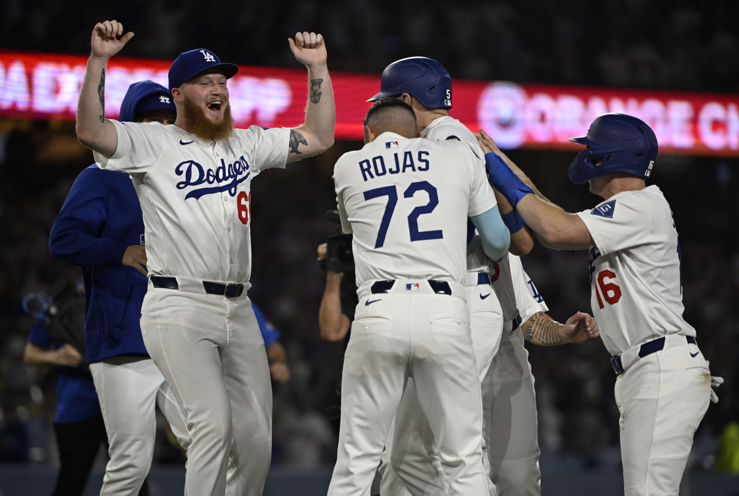 Los Angeles Dodgers mobbed Freddie Freeman #5 after his game...