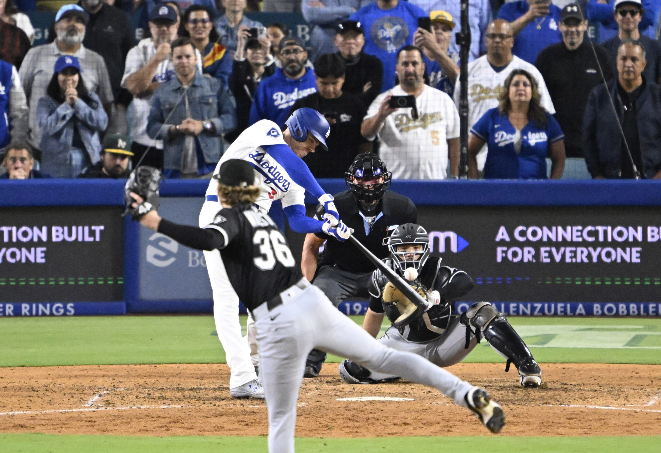 Freddie Freeman #5 of the Los Angeles Dodgers hits walk...