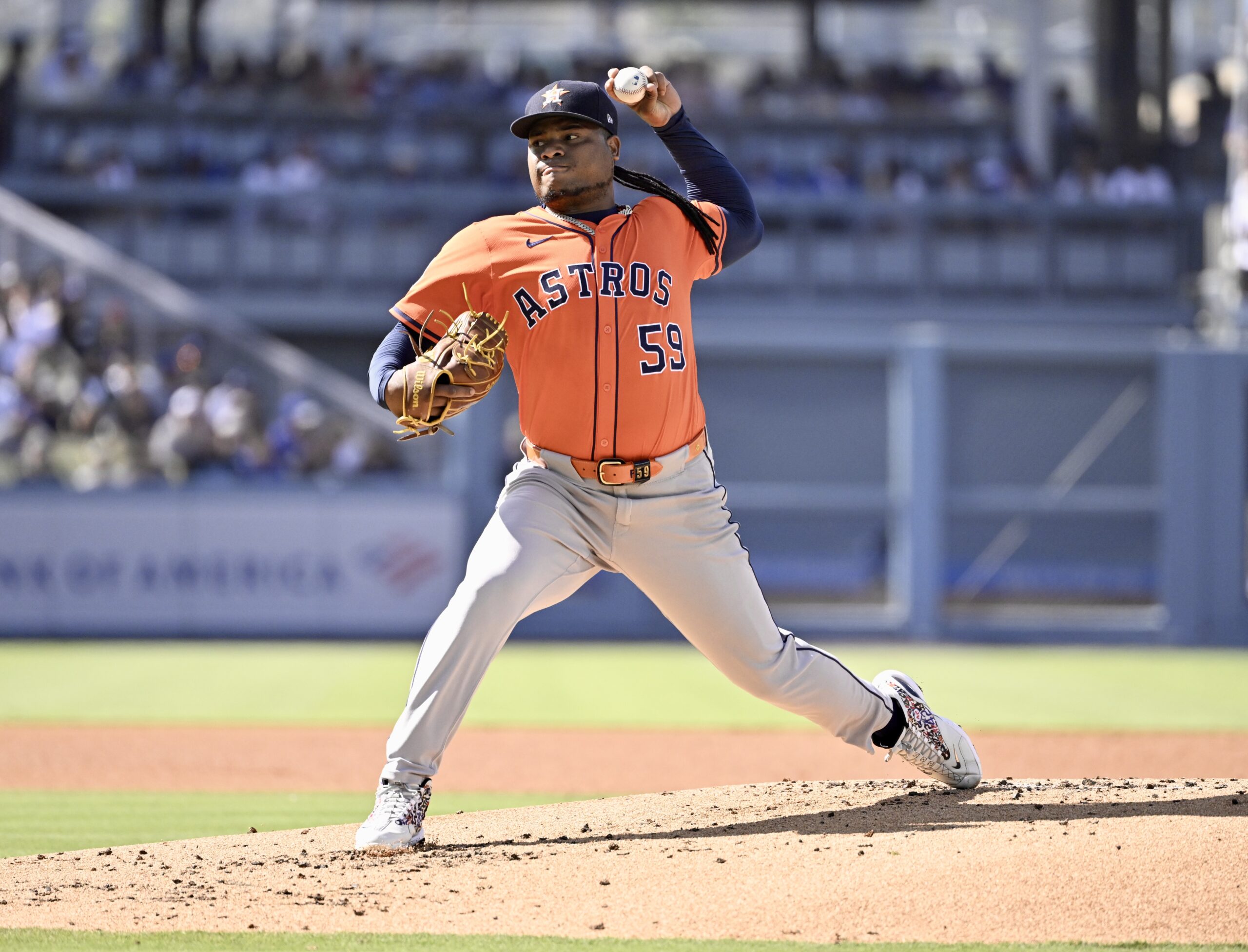 Starting pitcher Framber Valdez #59 of the Houston Astros throws...