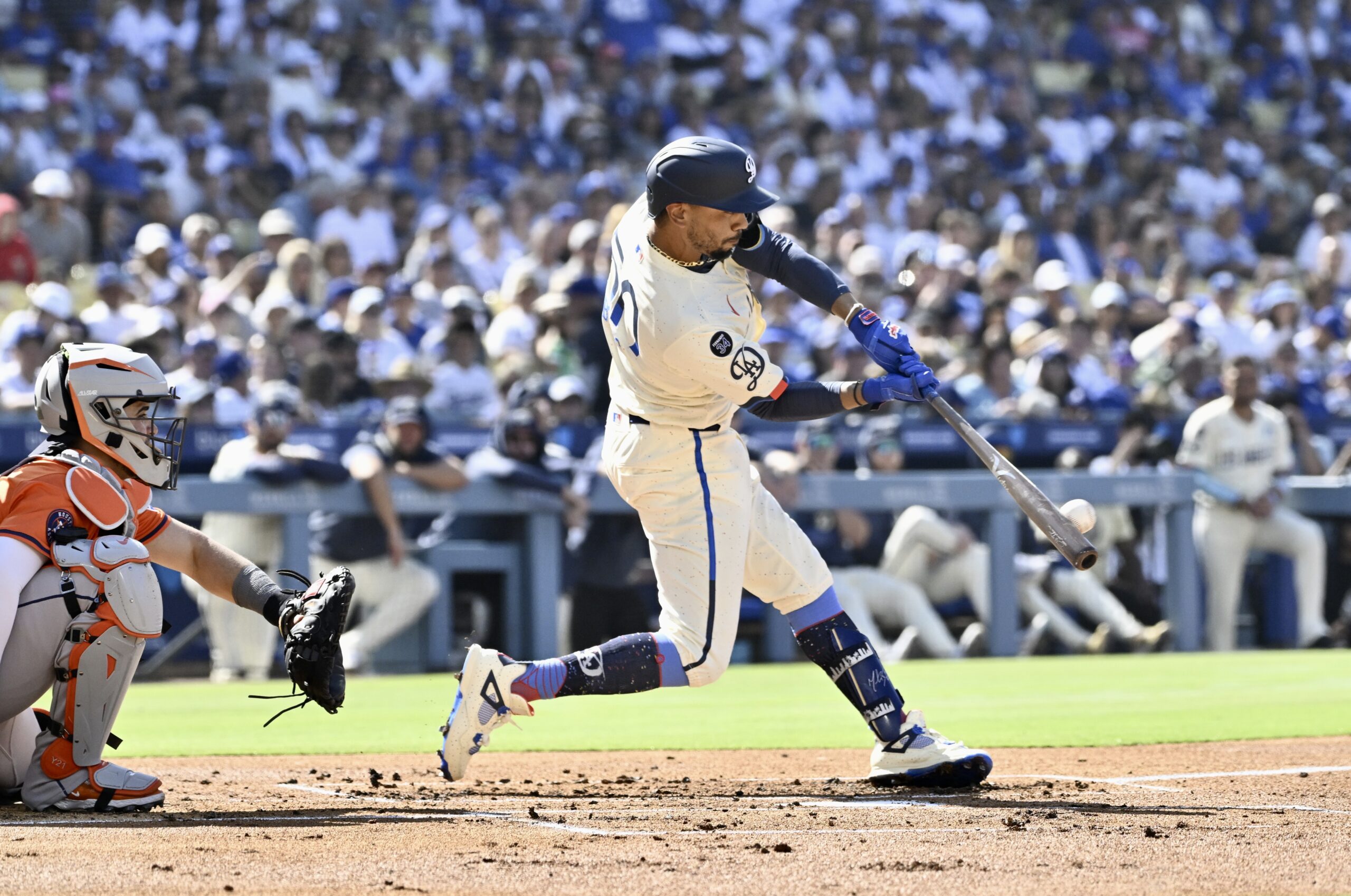 Mookie Betts #50 of the Dodgers hits a solo home...