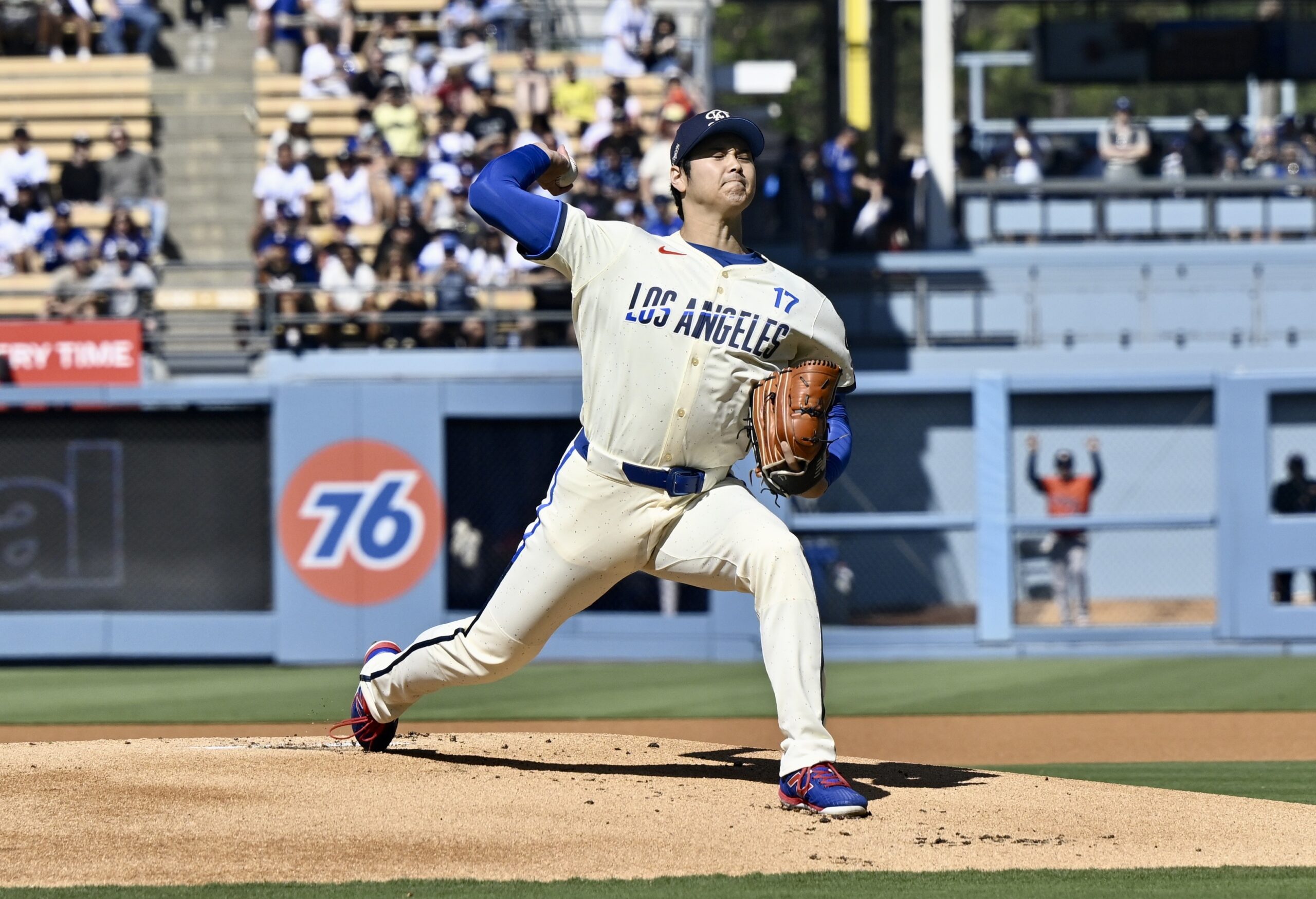 Starting pitcher Shohei Ohtani #17 of the Dodgers throws to...