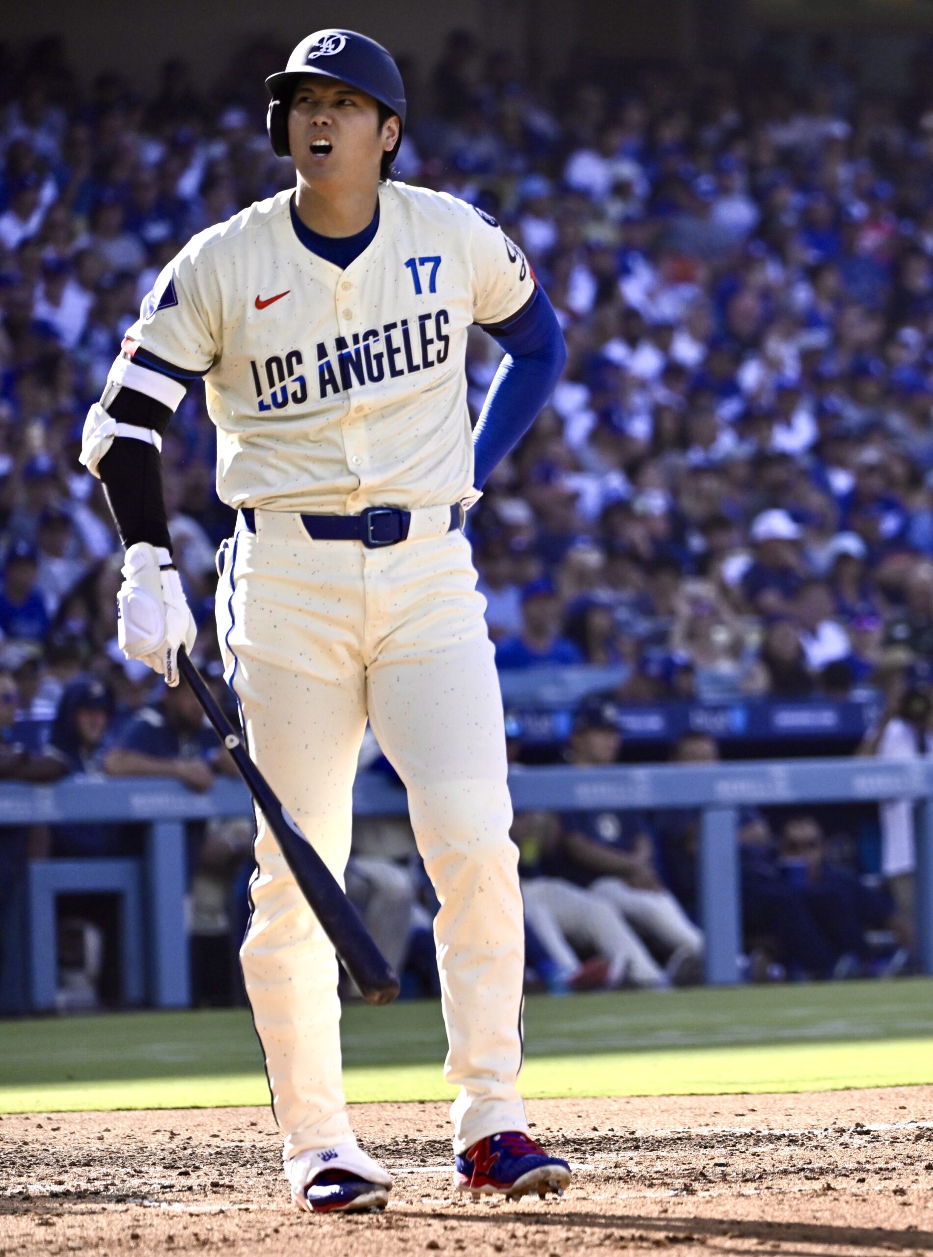 Shohei Ohtani #17 of the Dodgers reacts at bat against...