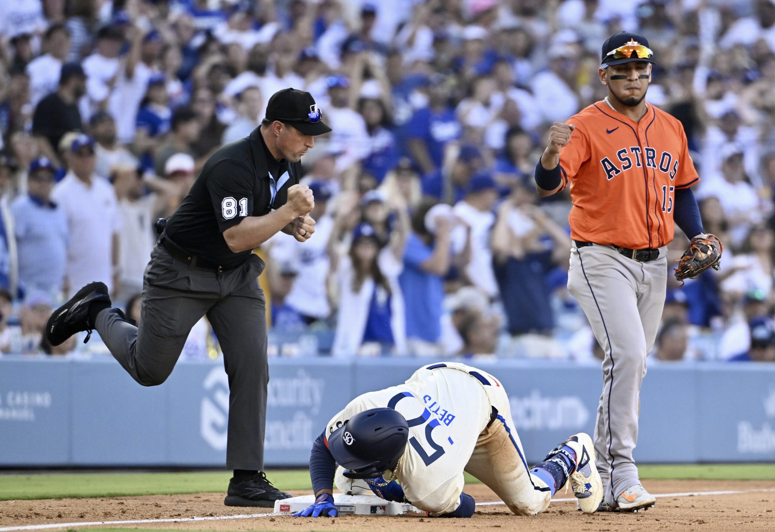 Third baseman Isaac Paredes #15 of the Houston Astros reacts...
