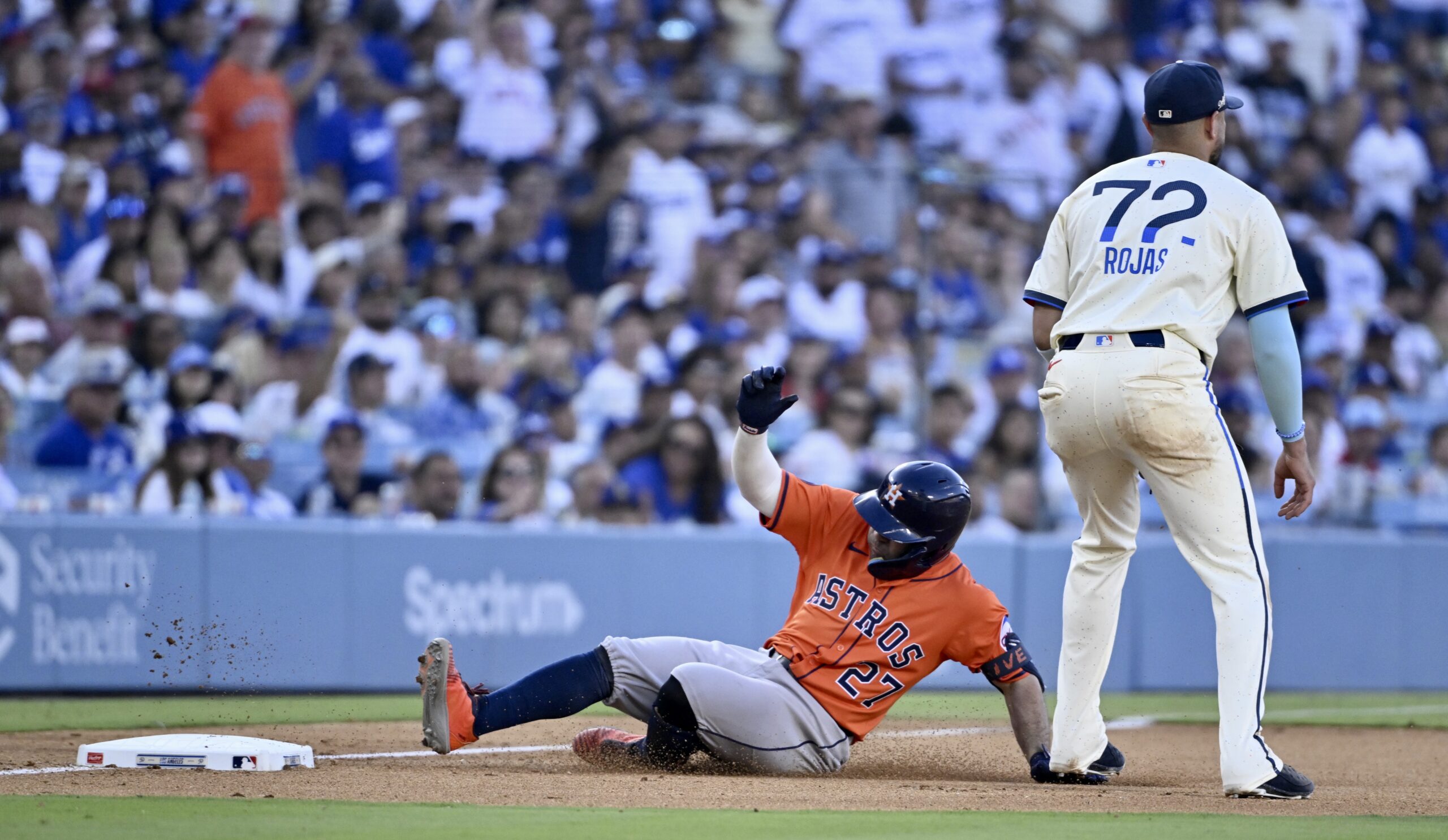 Jose Altuve #27 of the Houston Astros triples against the...