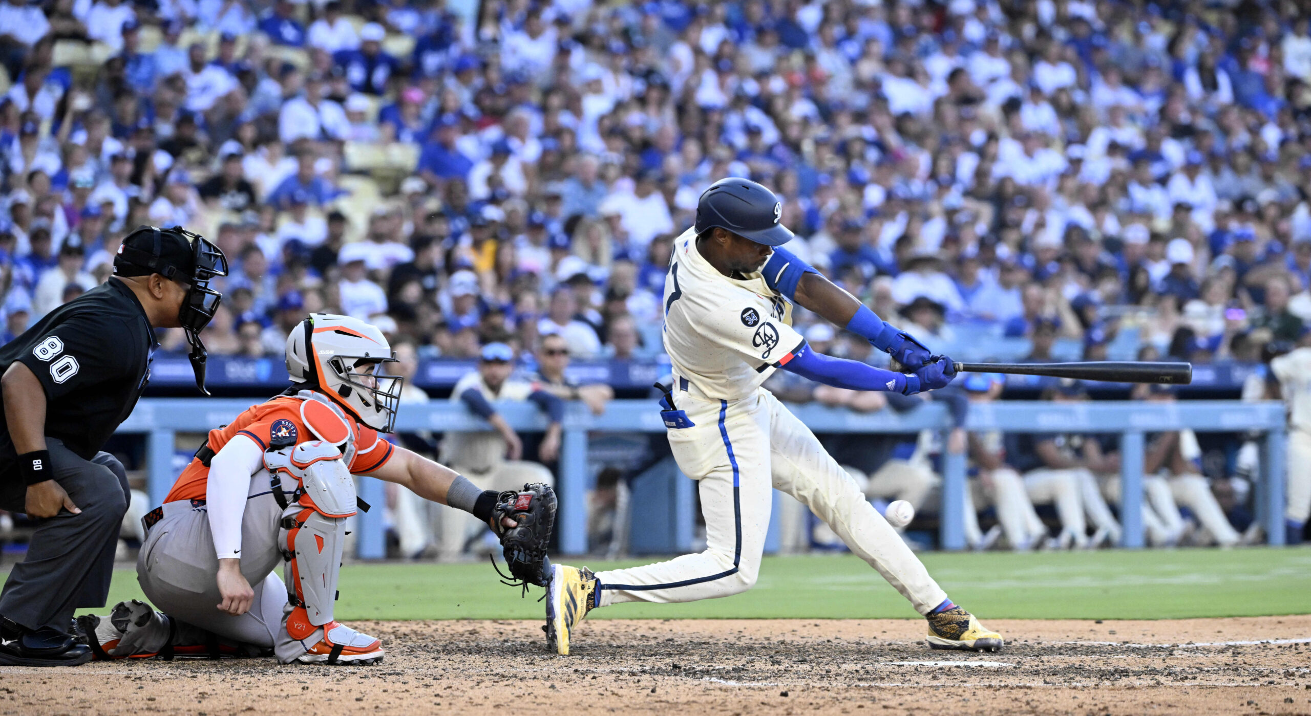 Esteury Ruiz #27 of the Dodgers strikes out swinging with...