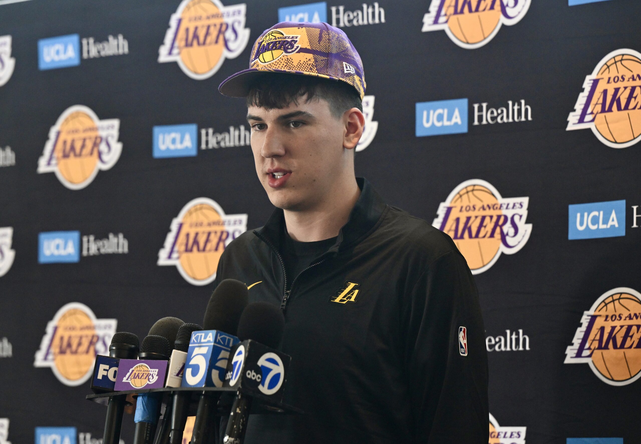 New Lakers forward Jake LaRavia speaks to reporters during an...