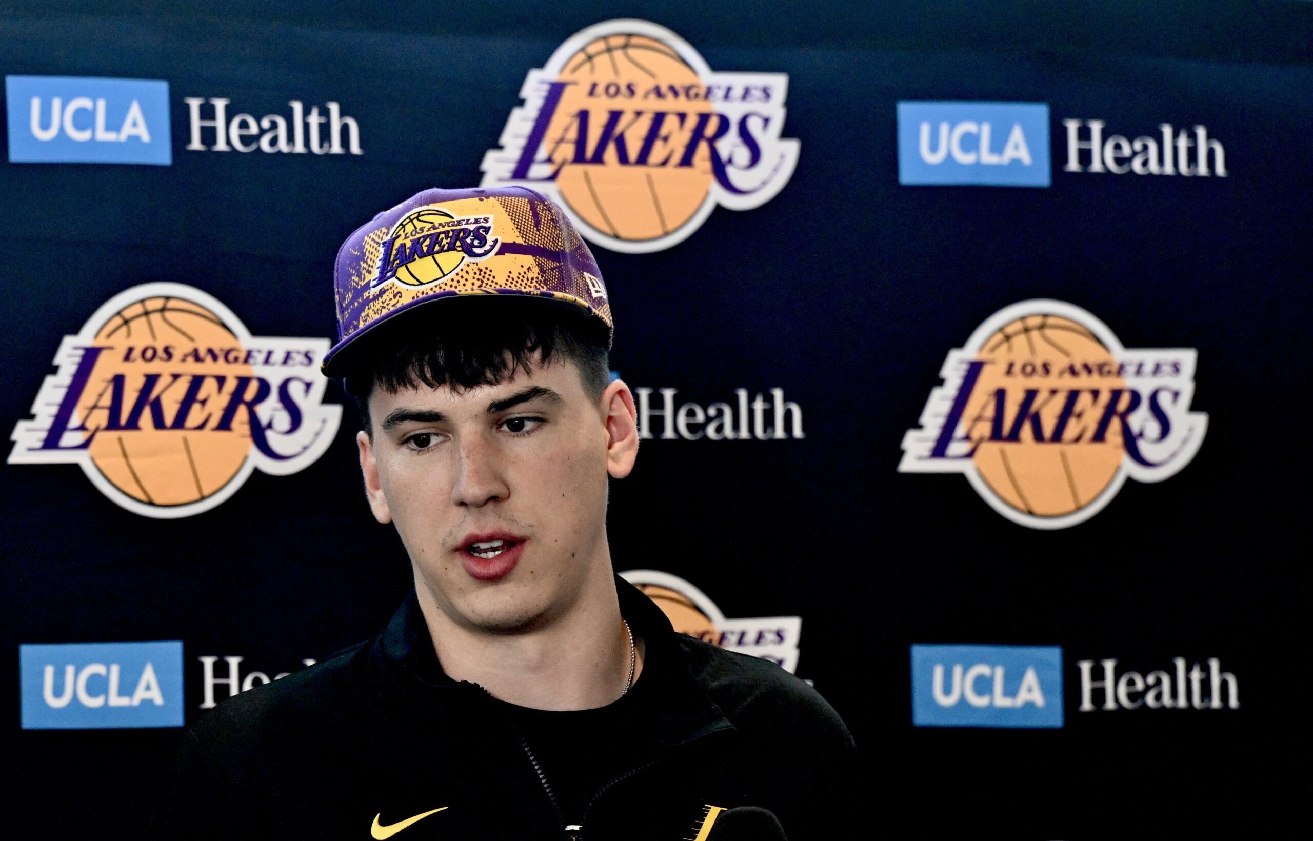 New Lakers forward Jake LaRavia speaks to reporters during an...