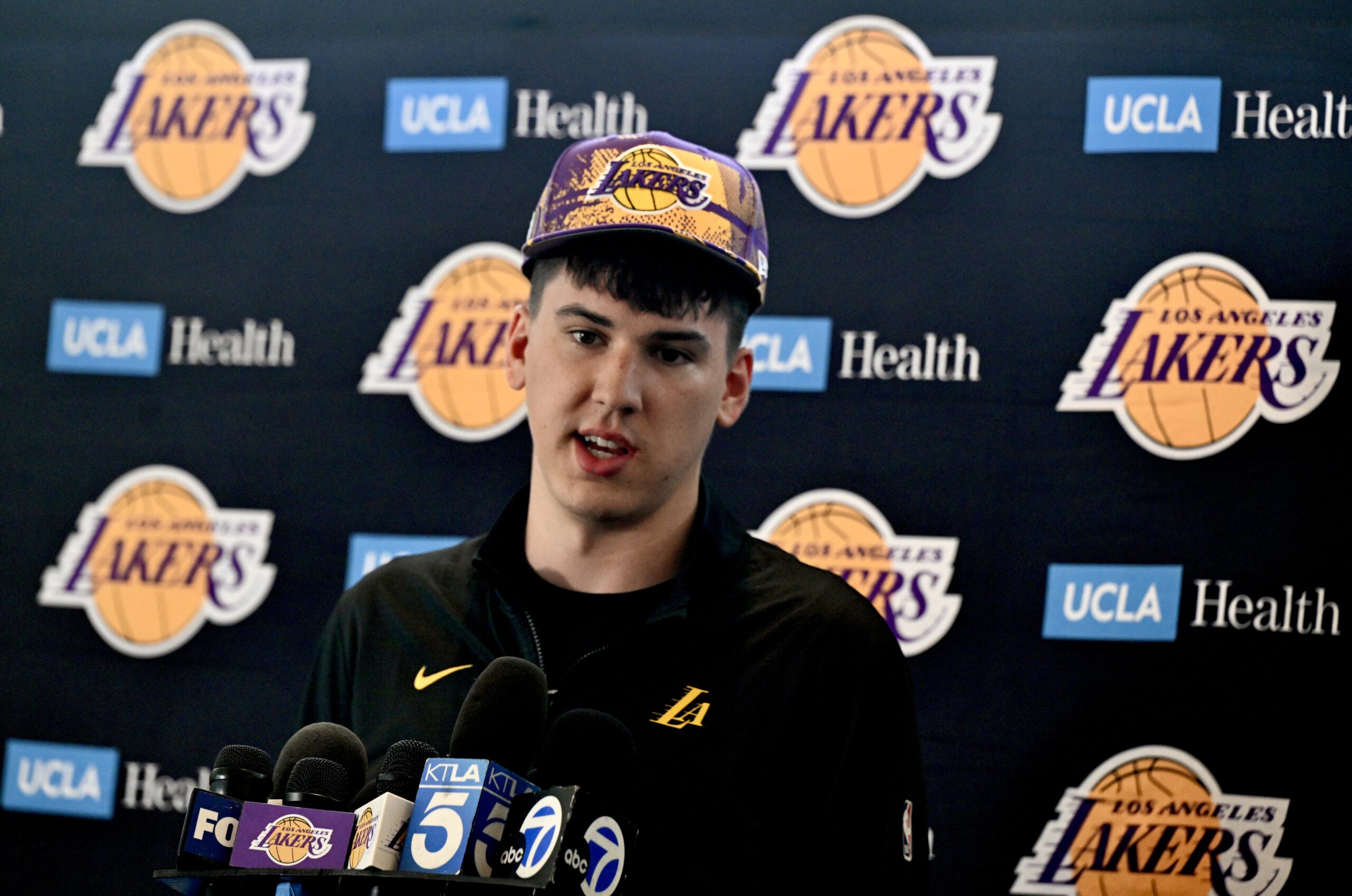 New Lakers forward Jake LaRavia speaks to reporters during an...
