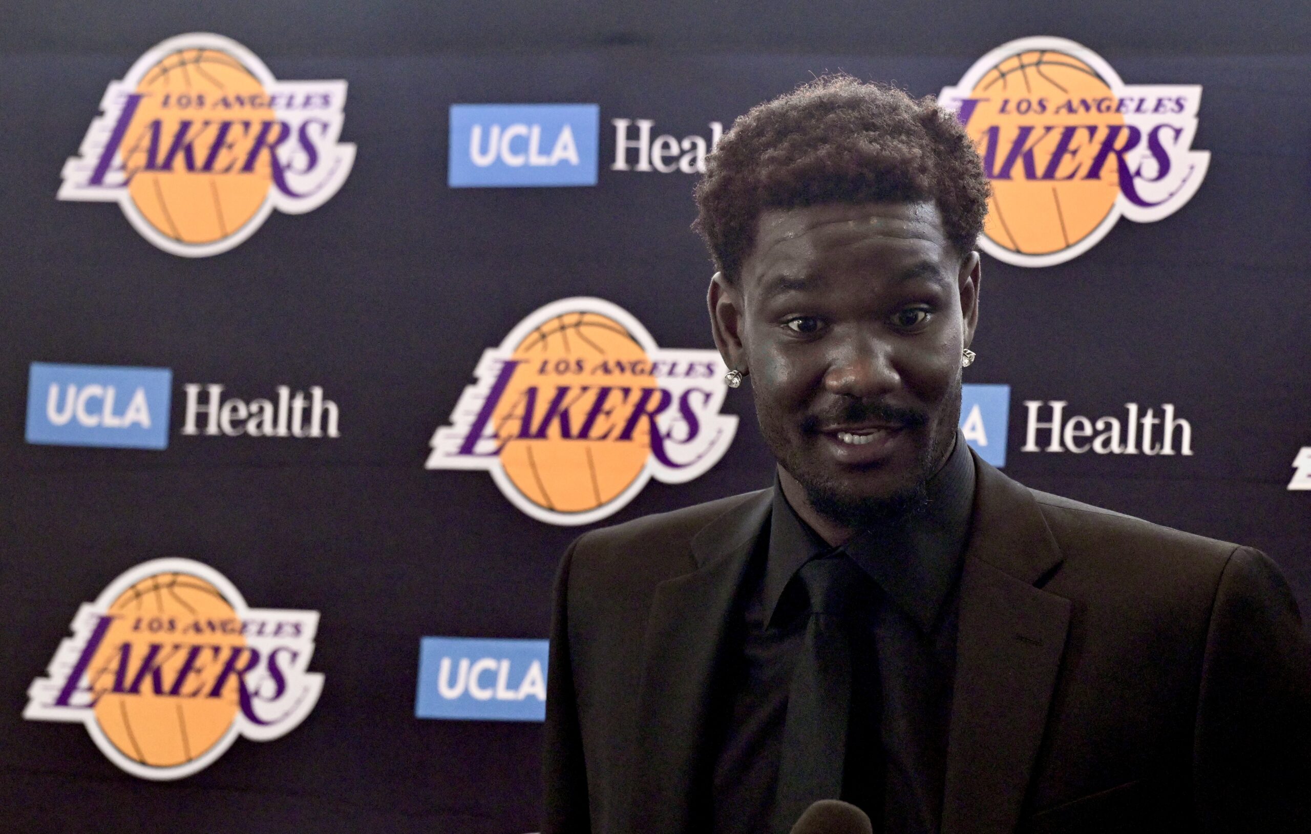 New Lakers center Deandre Ayton speaks to reporters during an...