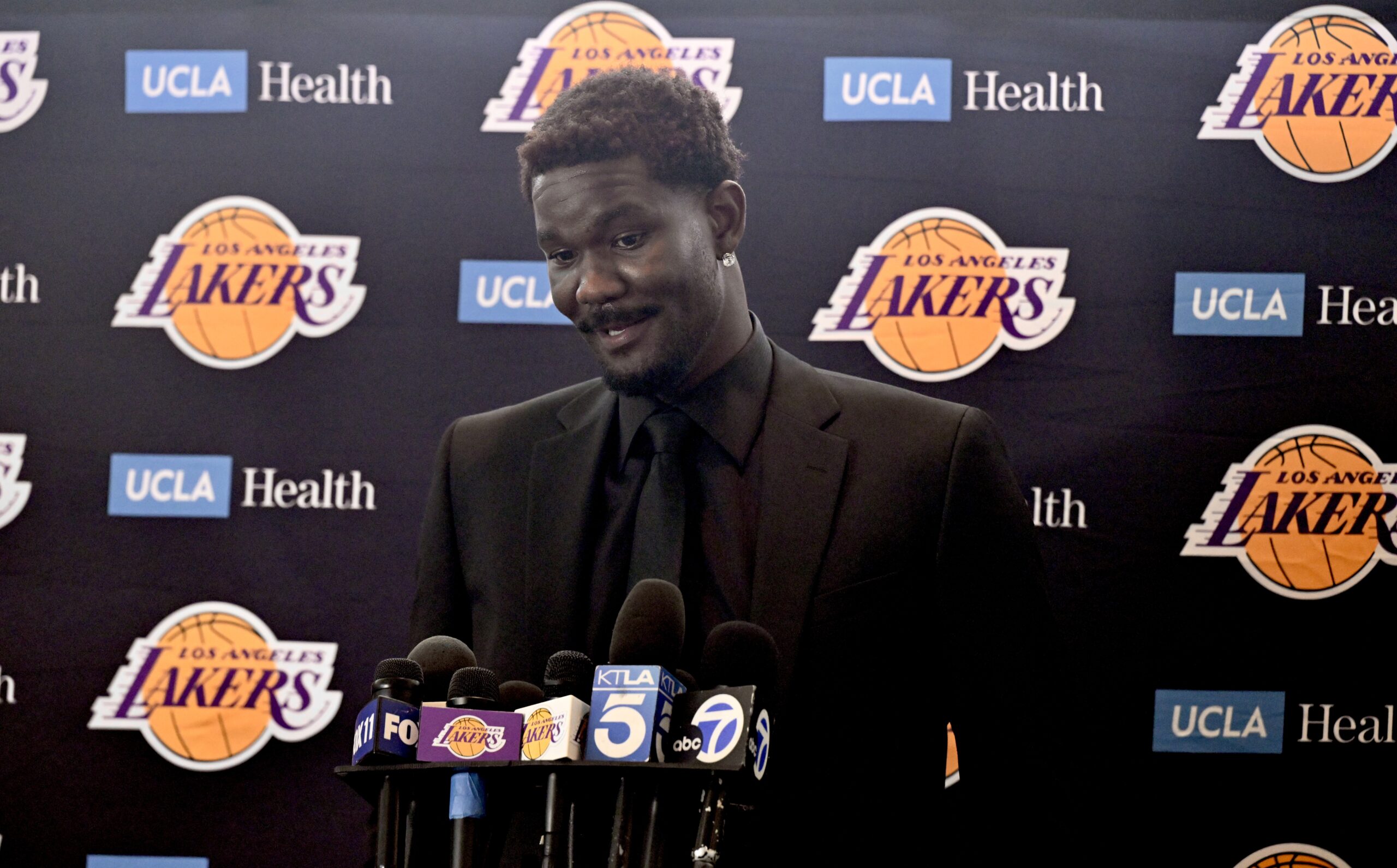 New Lakers center Deandre Ayton speaks to reporters during an...