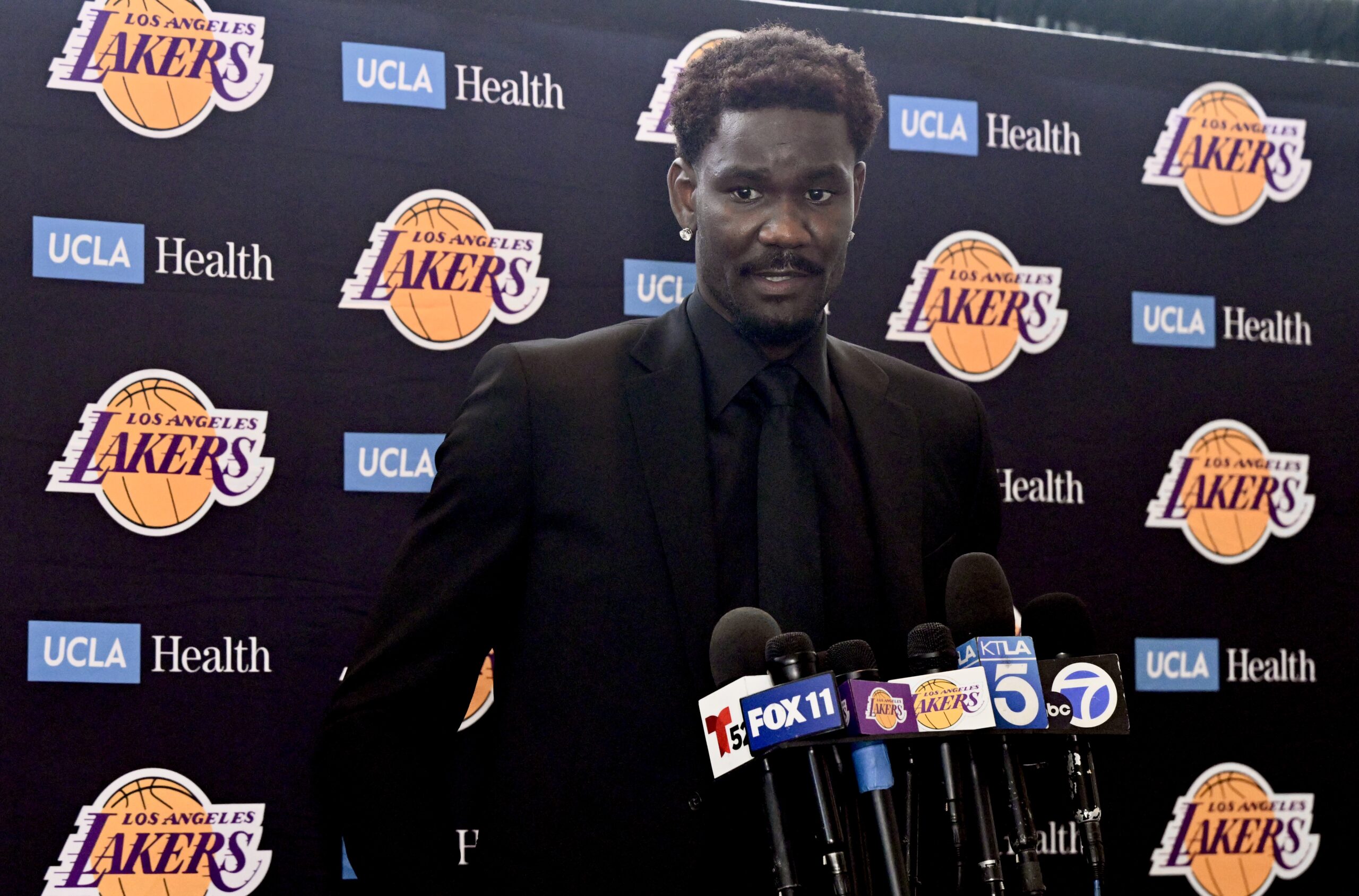 New Lakers center Deandre Ayton speaks to reporters during an...