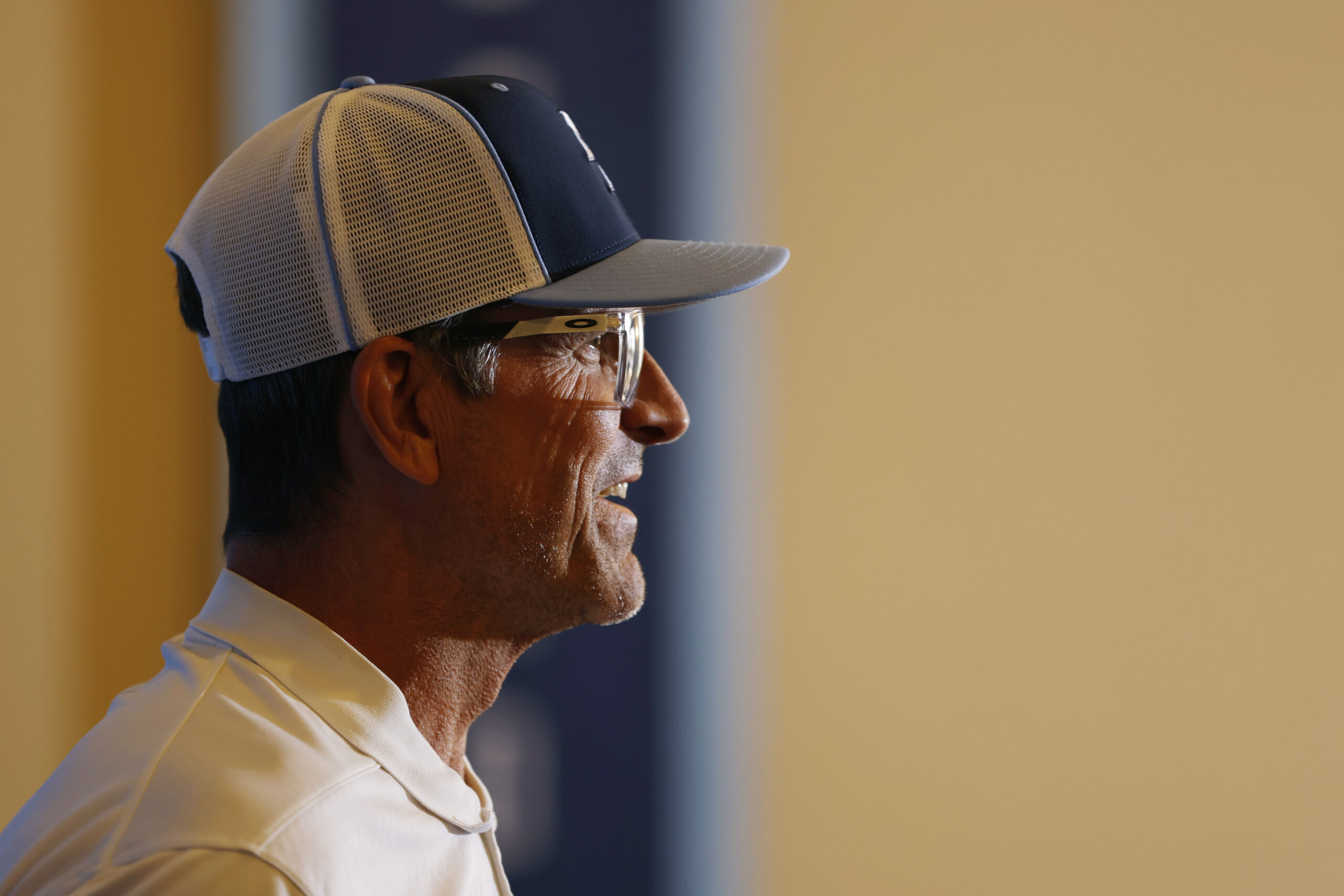 Chargers head coach Jim Harbaugh speaks before a practice at...