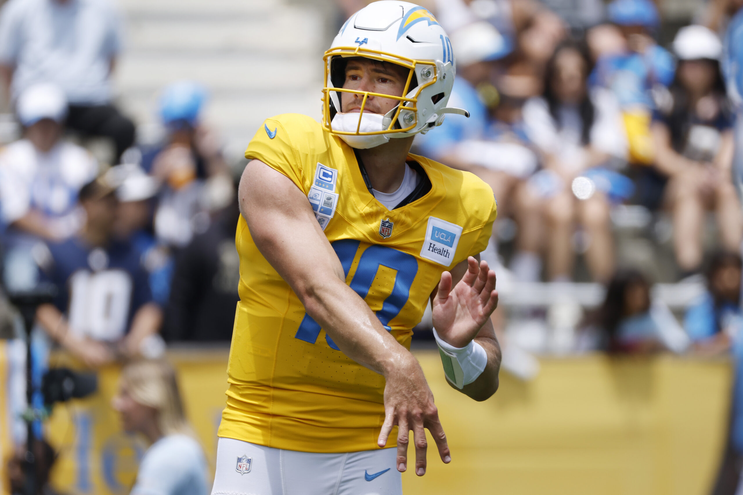 Chargers quarterback Justin Herbert throws a pass during a practice...