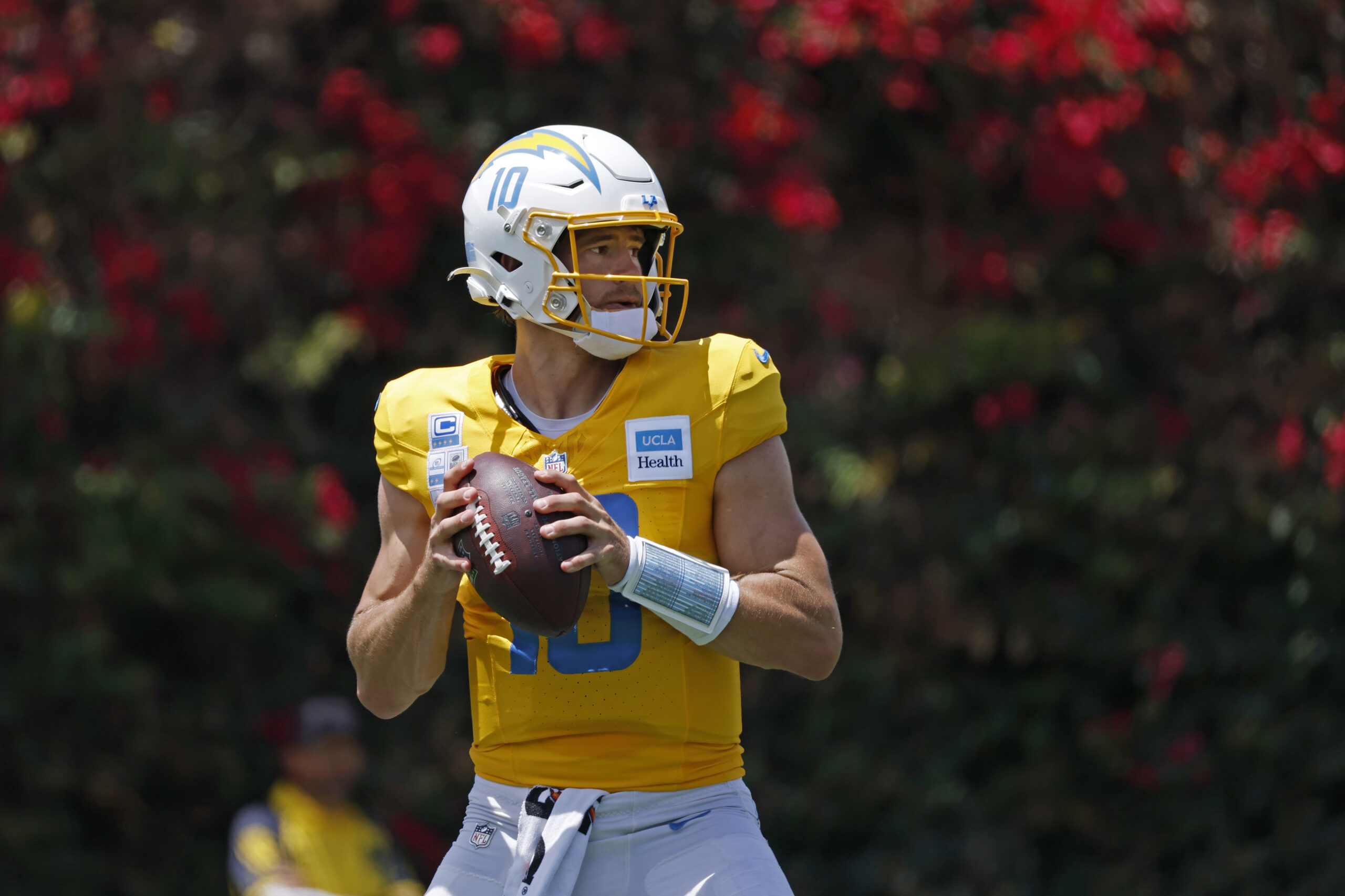 Chargers quarterback Justin Herbert drops back to pass during a...