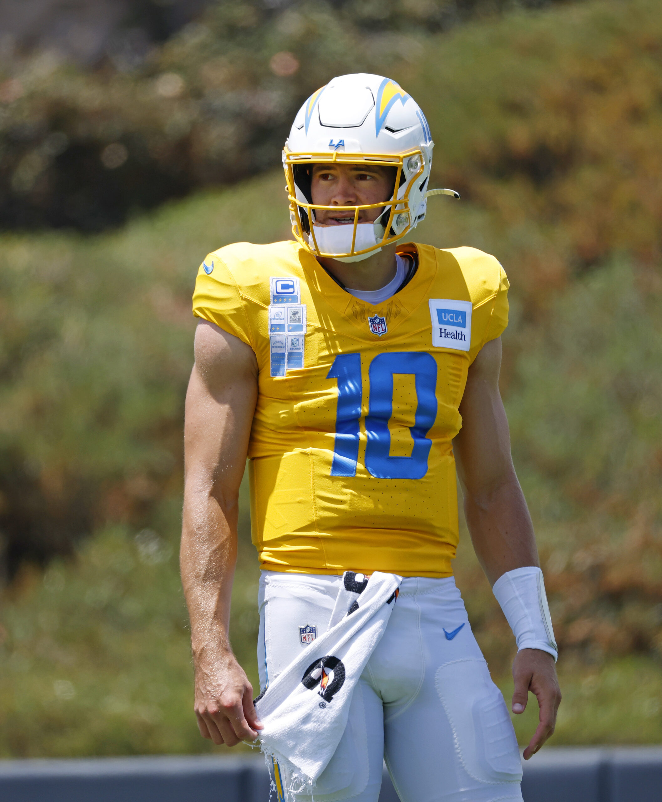 Chargers quarterback Justin Herbert looks on during a practice at...